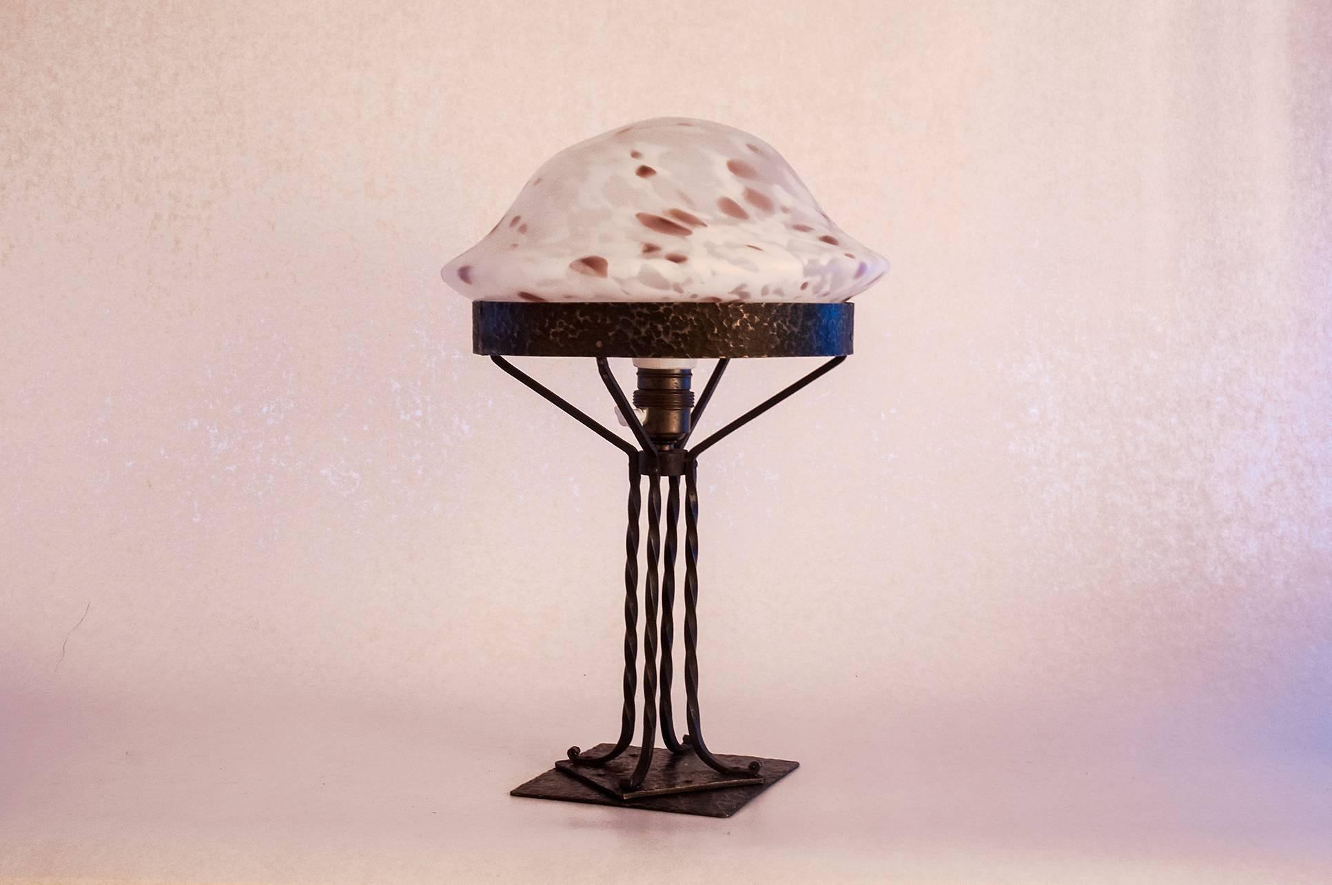 A Swedish table lamp made, circa 1910-1915 with a beautiful spotted glass shade, the shade has a 