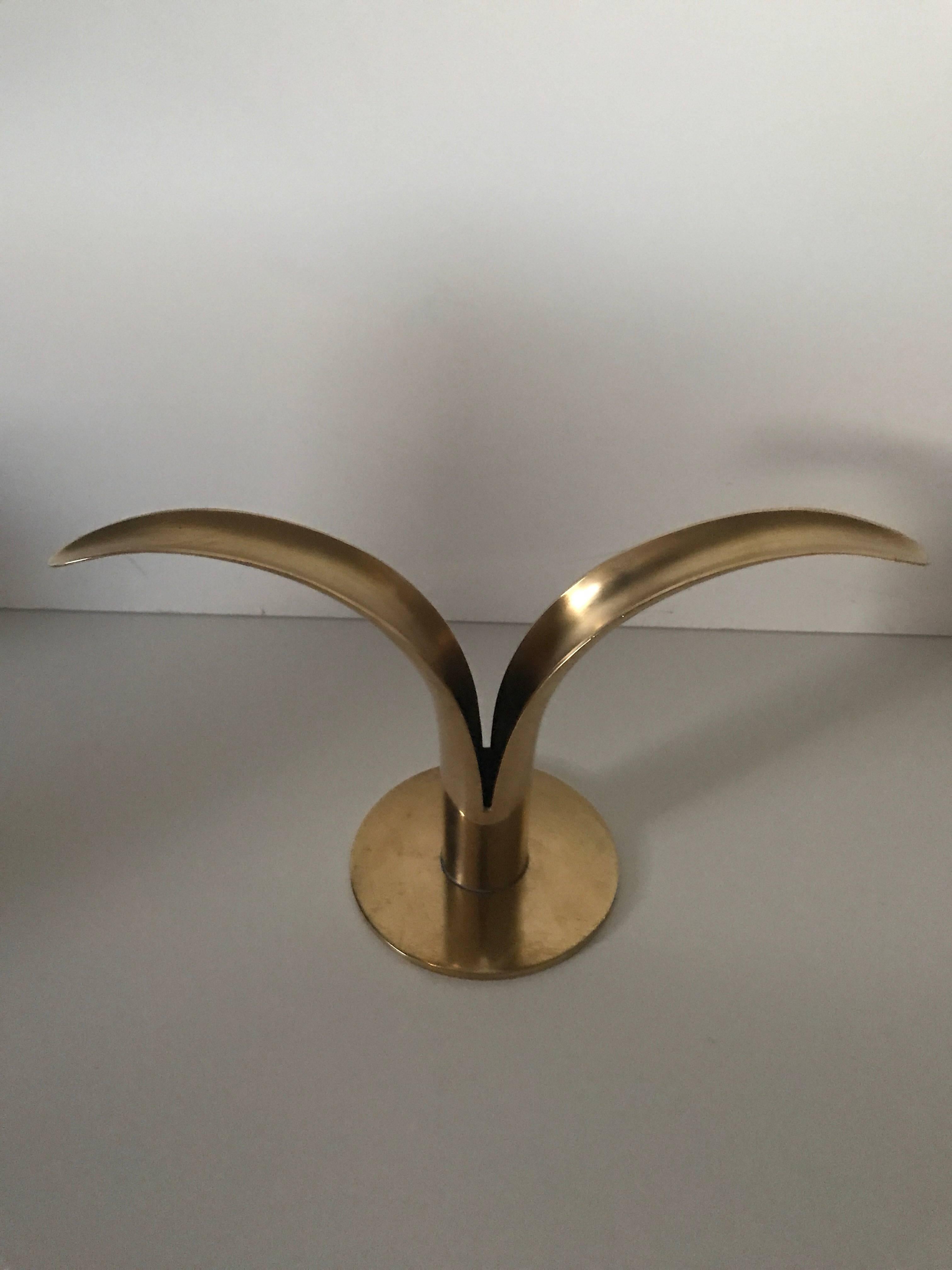 Pair of 1950, Swedish brass candleholders Liljan by Ivar Ålenius Björk at Ystad Metal. There are two pair available and the price is for the pair.
They measure 21 cm wide, 12 cm high and 8cm in diameter to the base.


