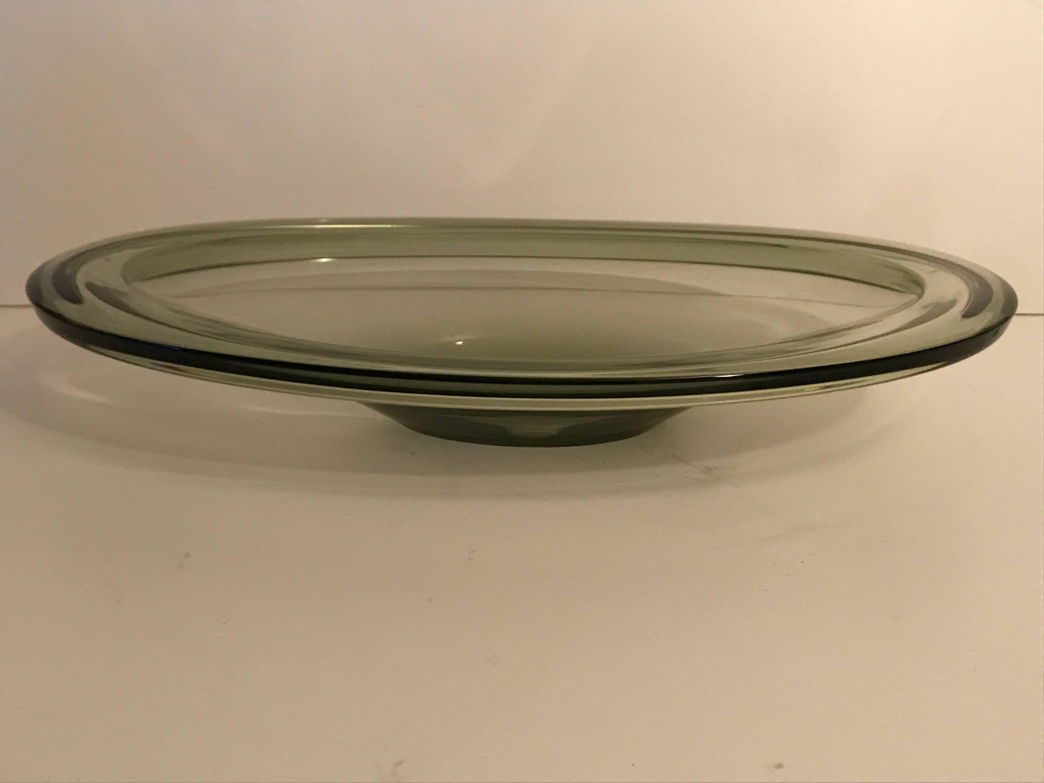 1955 Swedish Kosta oval glass dish by Vicke Lindstrand.
A very nice green/grey toned glass centerpiece dish made by one of the greatest Swedish glass designers during the 20th century, Vicke Lindstrand at Kosta, circa 1955.
The dish is marked L H