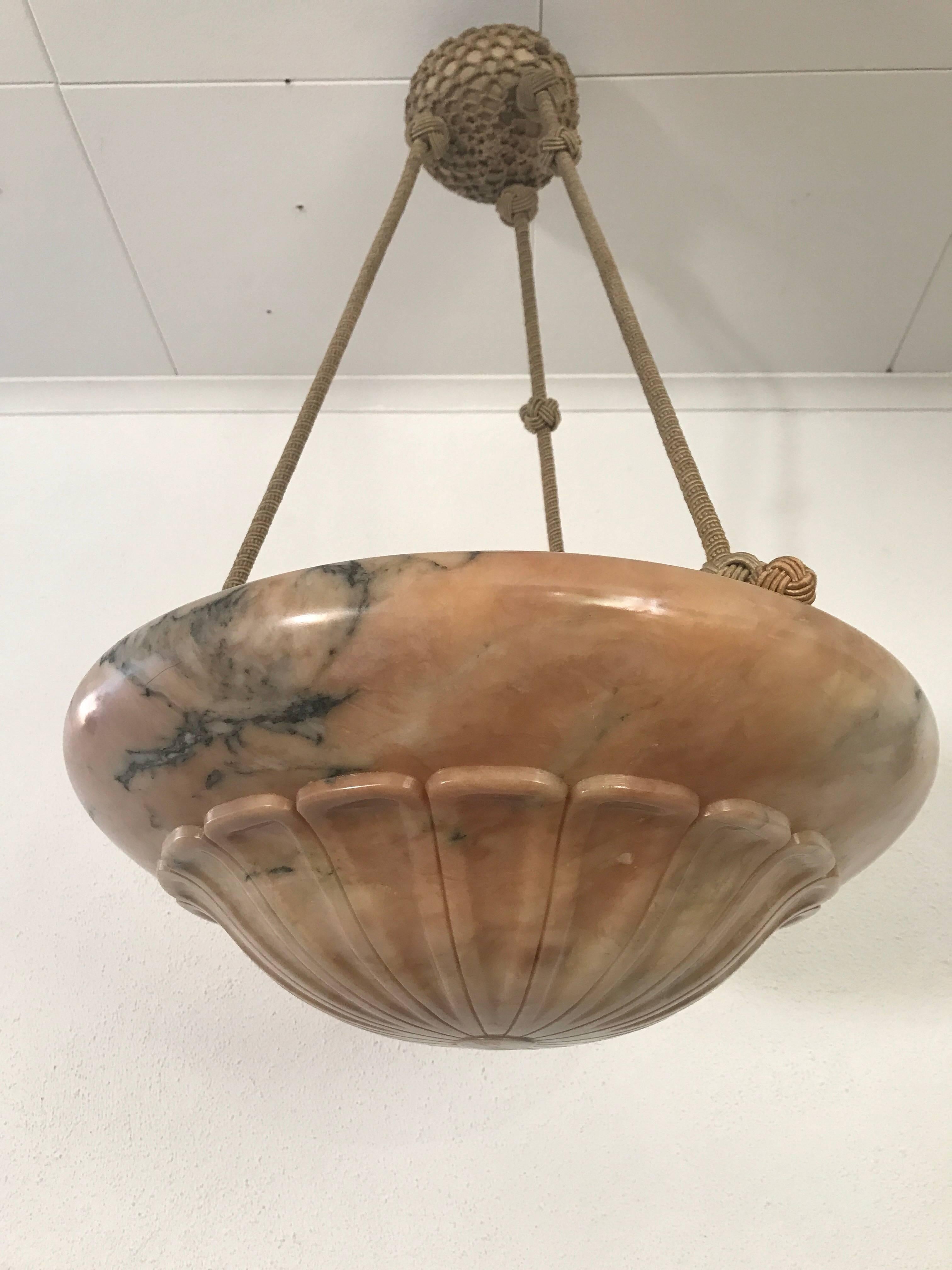Swedish Art Nouveau Jugendstil carved Alabaster pendant lamp chandelier.
A very nice and beautiful carved alabaster terracotta coloured pendant lamp made circa 1915. The lamp is in a very nice original working condition and all the wires has been