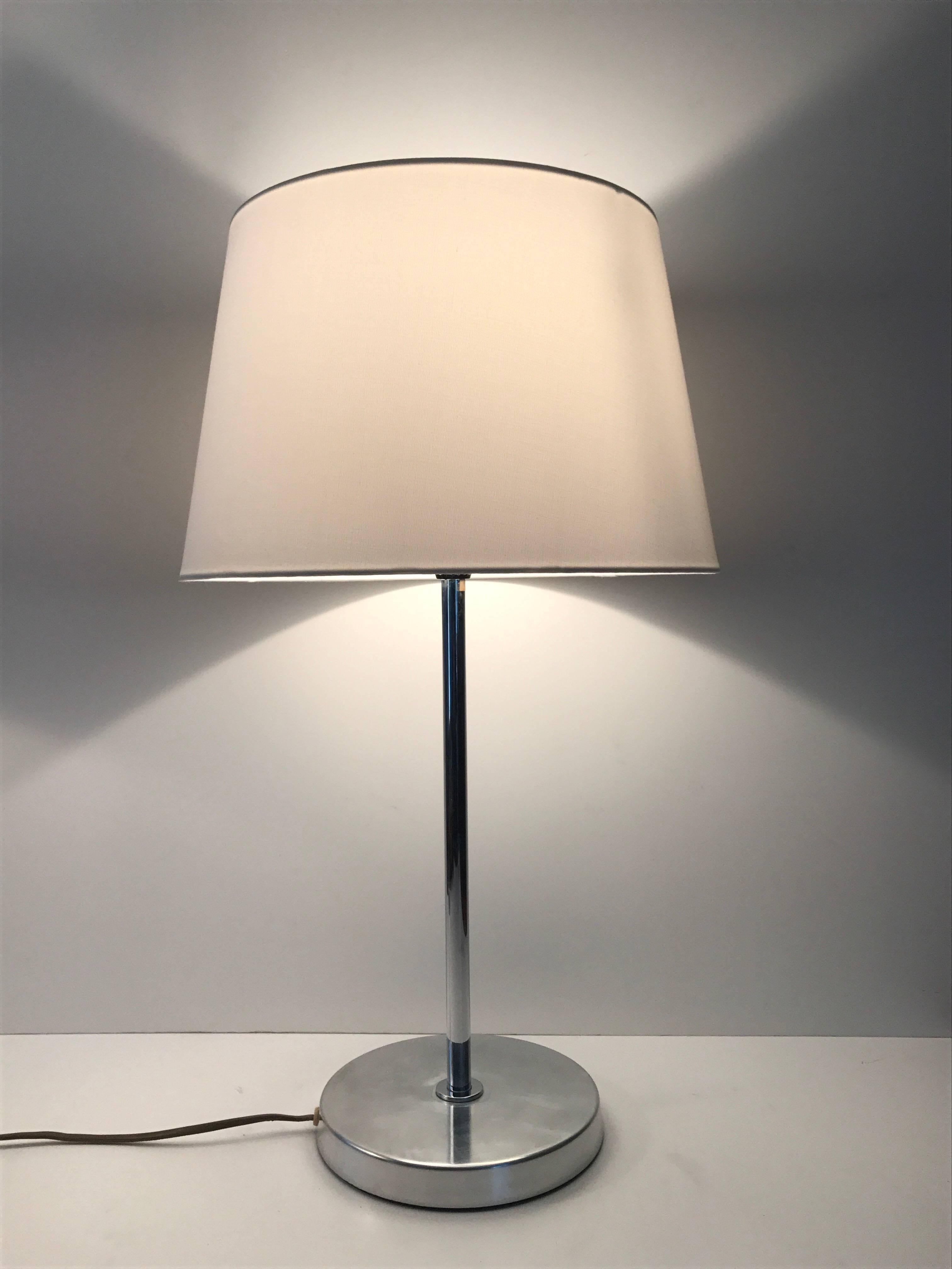 Pair of Swedish Bergboms steel table lamps, 1955. Another pair of simple but yet very elegant and Classic Swedish designed lamps by Bergboms. This pair is made of steel and has a chromed centre rod. They are marked with a sticker that says Bergboms