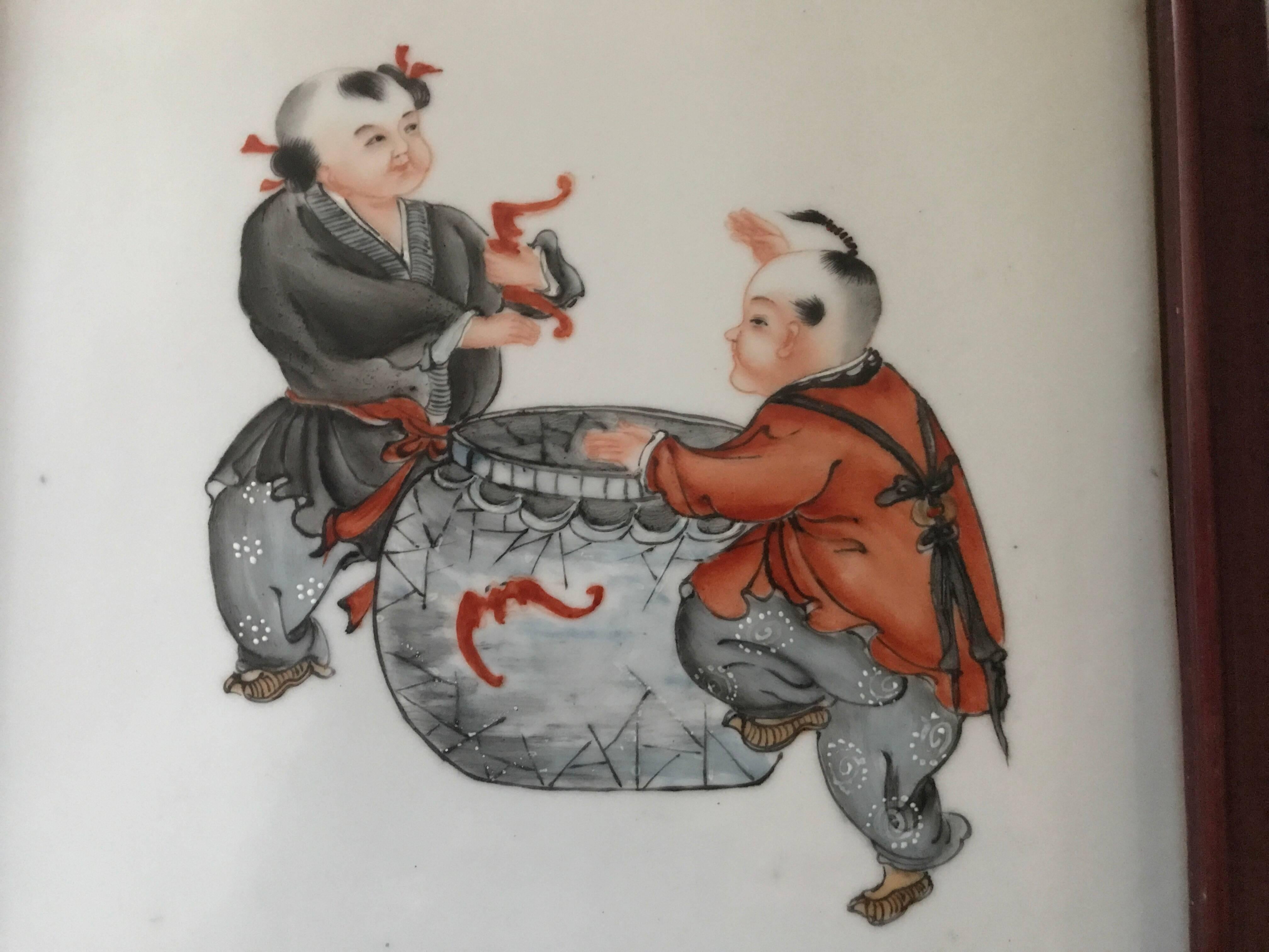 Chinese republic famille rose porcelaine framed wall plaque or wall painting.
A very nice and high quality porcelaine wall plaque made in the first half of the 20th century during the early republic era. The plaque depicts a pair of boys collecting