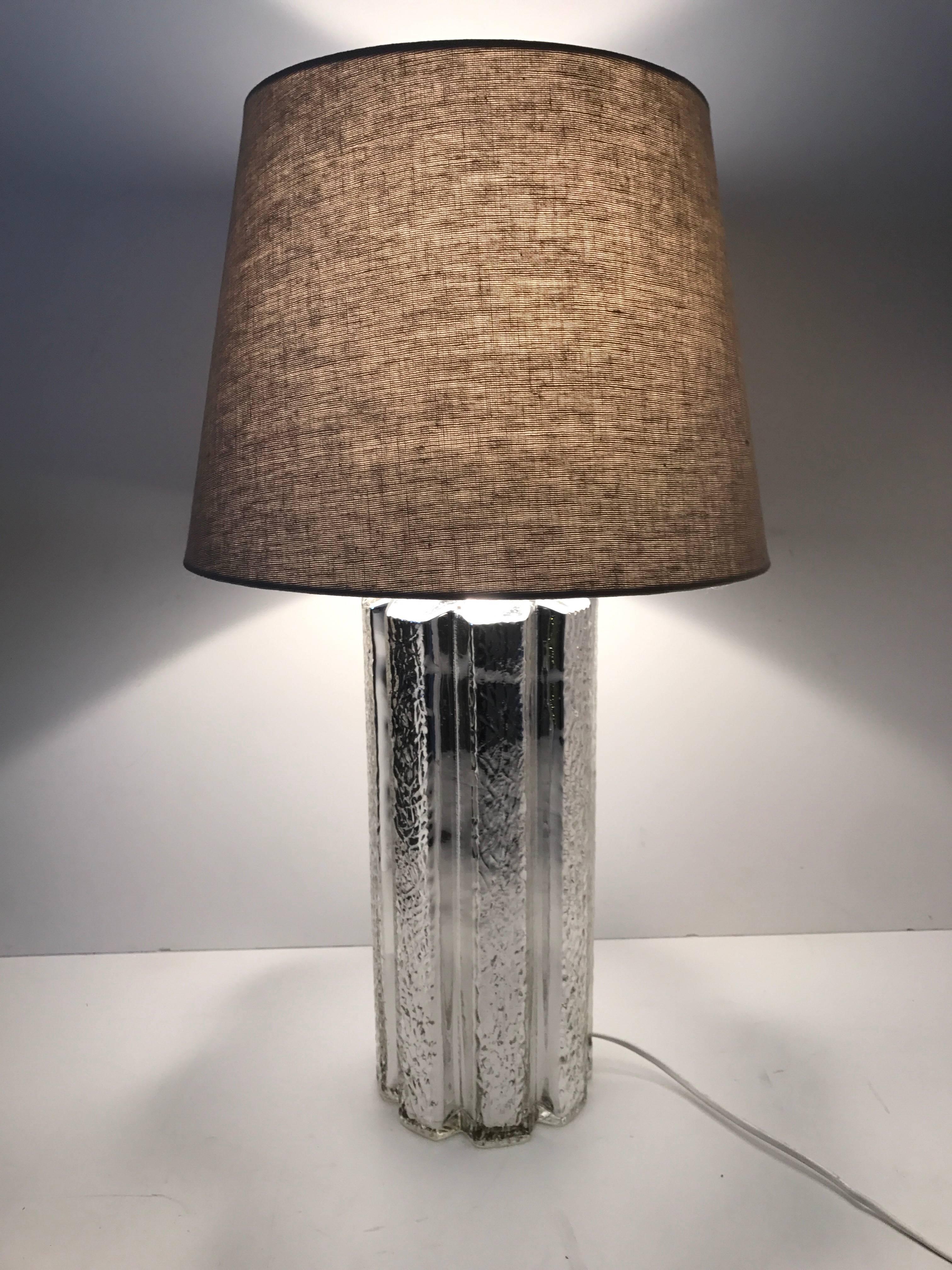 Very rare large Swedish Flygsfors and Helena Tynell mercury glass table lamp.
A very beautiful mercury silver glass table lamp, the silver is underneath a layer of clear glass and makes a very nice 3D appearance. The lamp is in a fantastic