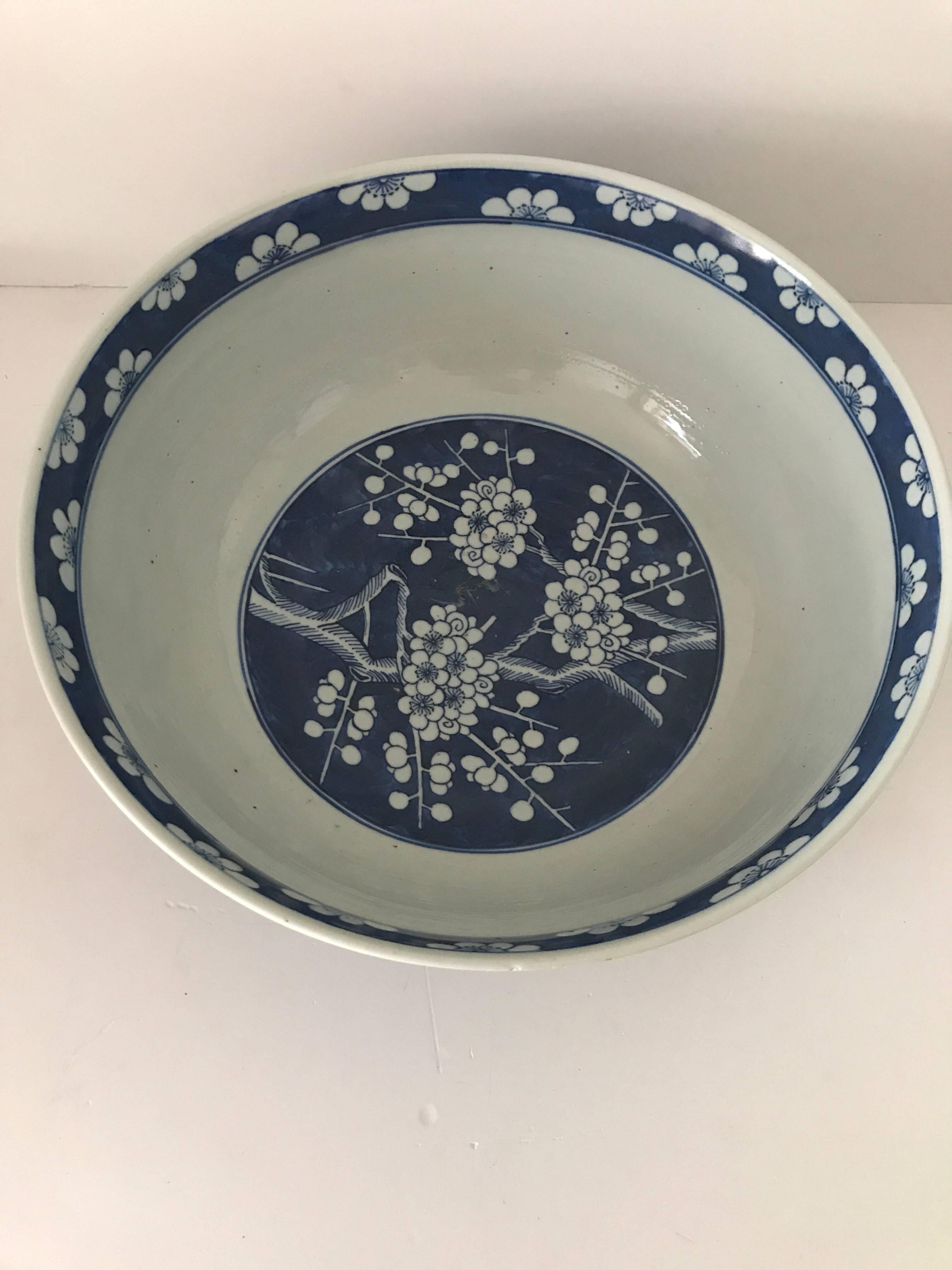 Very large punch Chinese 19th century blue and white porcelain punch bowl. 
The bowl is painted in a Kangxi style and is extremely large and the diameter is 40 cm, the height is 16.5 cm. 
The condition is good but there has is a star crack to the