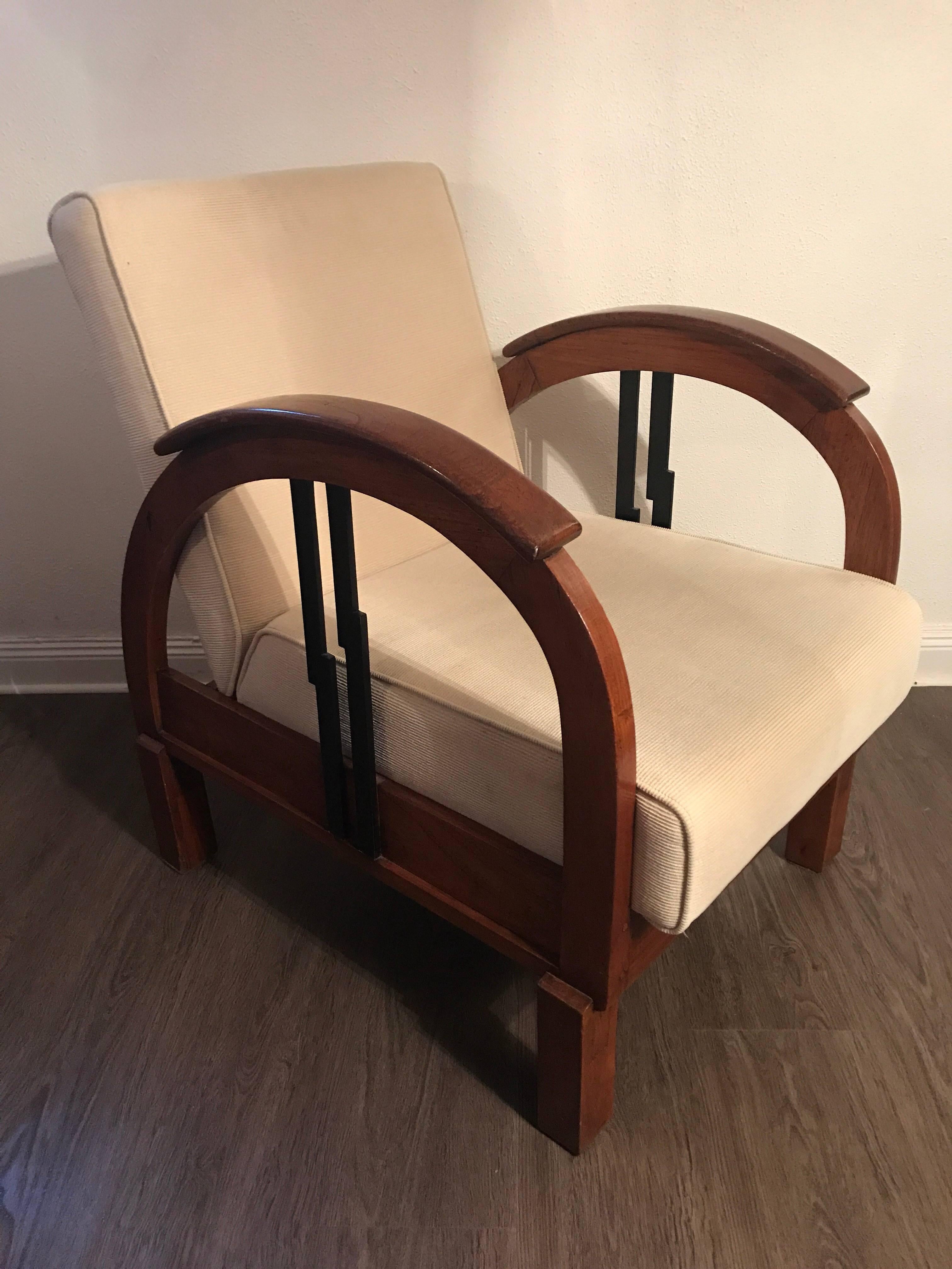 Pair French 1930 Art Deco Colonial Wood Armchairs. 
A beautiful and rare pair of presumably elm wood art deco armchairs. These chairs were most likely made in France and are made in a very nice shape with the bow and semicircular armrests. They have