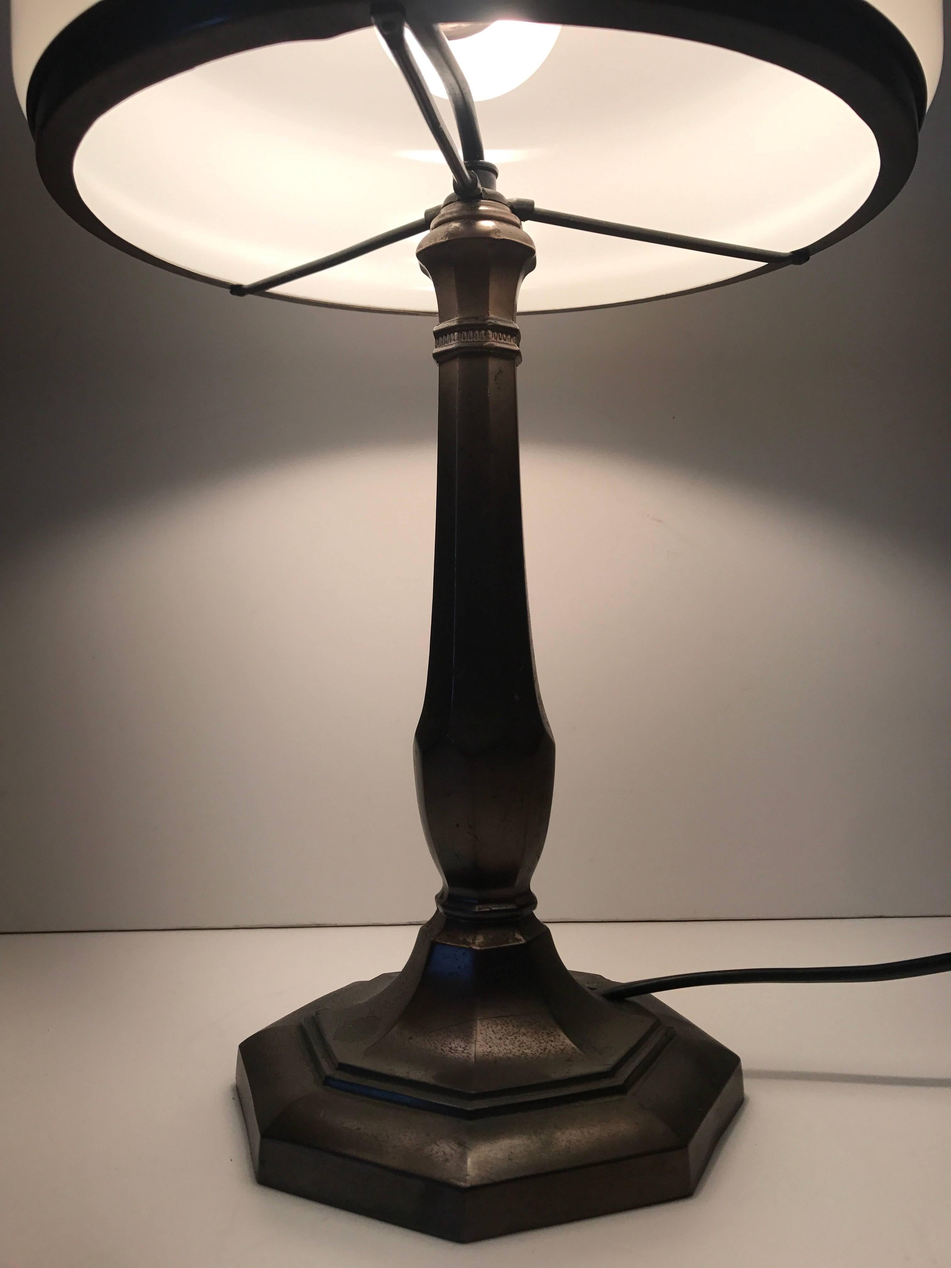Swedish Jugendstil Art Nouveau copper patinated metal table lamp.
A beautiful table lamp, made in the 1920s in Sweden, the glass shade comes most likely from the well known art glass workshops Orrefors or Pukeberg. The lamp is in a fantastic