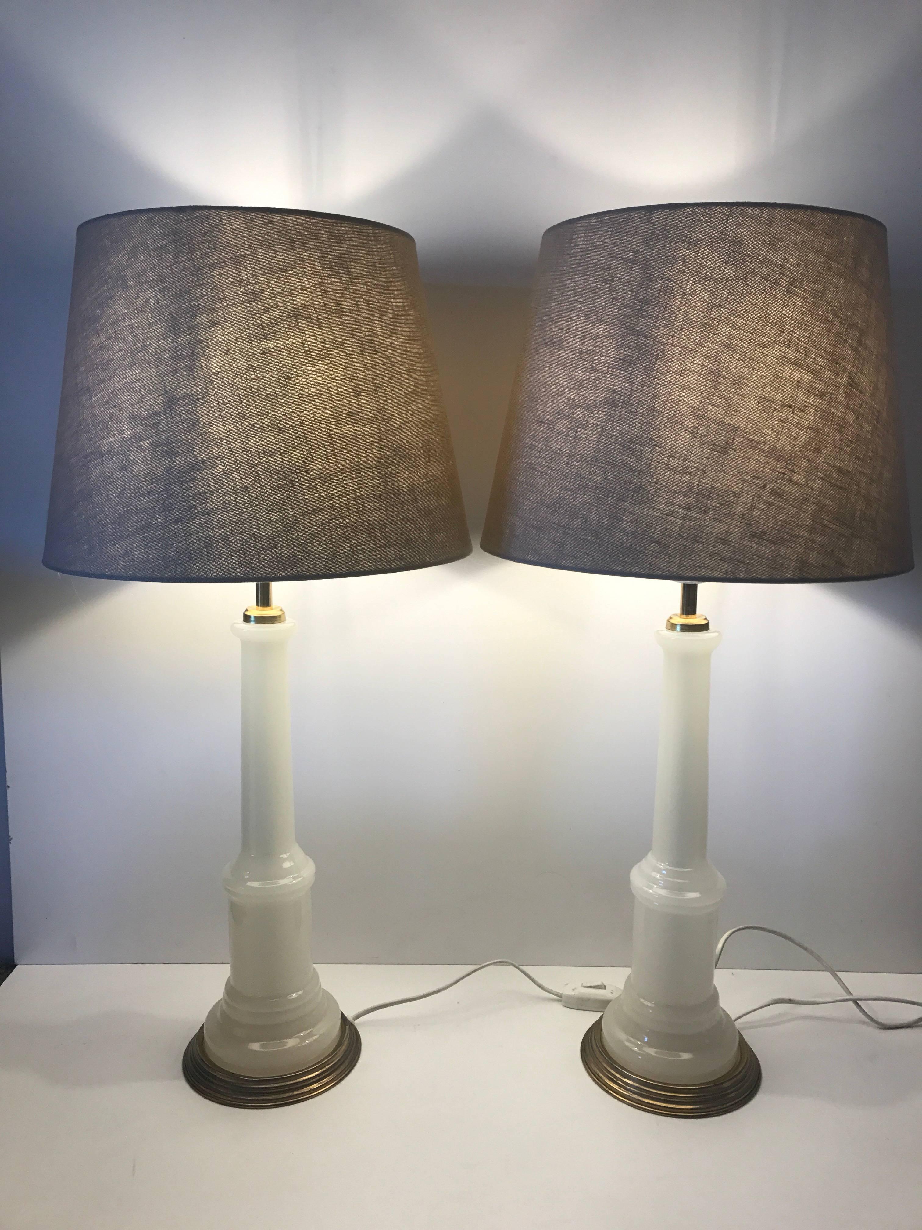 Pair of large Swedish Josef Frank opaline glass table lamps Svenskt Tenn model 2583. A beautiful pair of white color opaline glass and brass lamps. They are large and measure 67 cm including the shade in height and the shade has a bottom diameter of