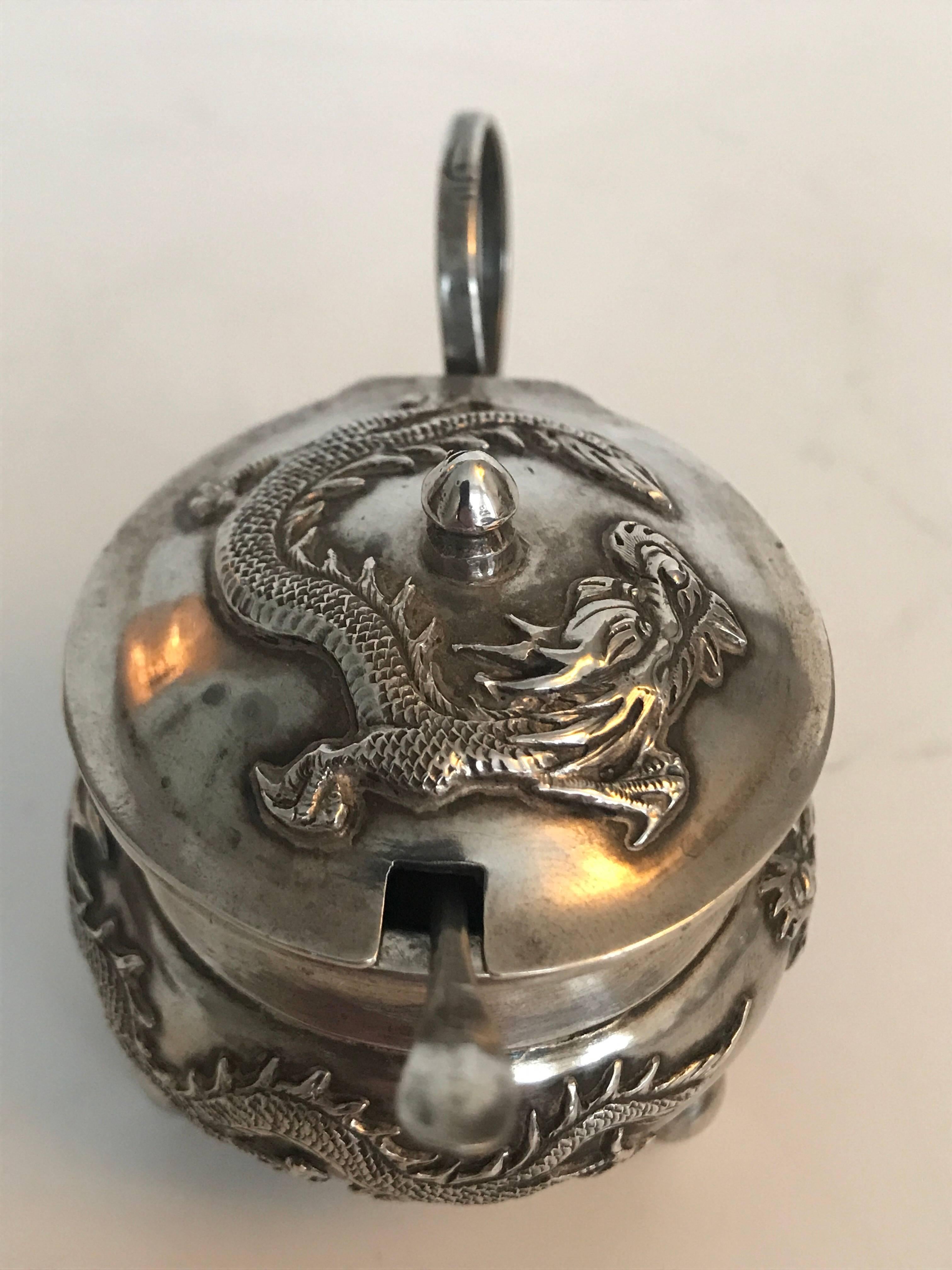 Wang Hing Chinese export silver dragon mustard pot with spoon, early 20th century.
A beautiful and very well made dragon mustard teapot, made by one of the best silver makers in China during the early 20th century, or Hong Kong actually. The