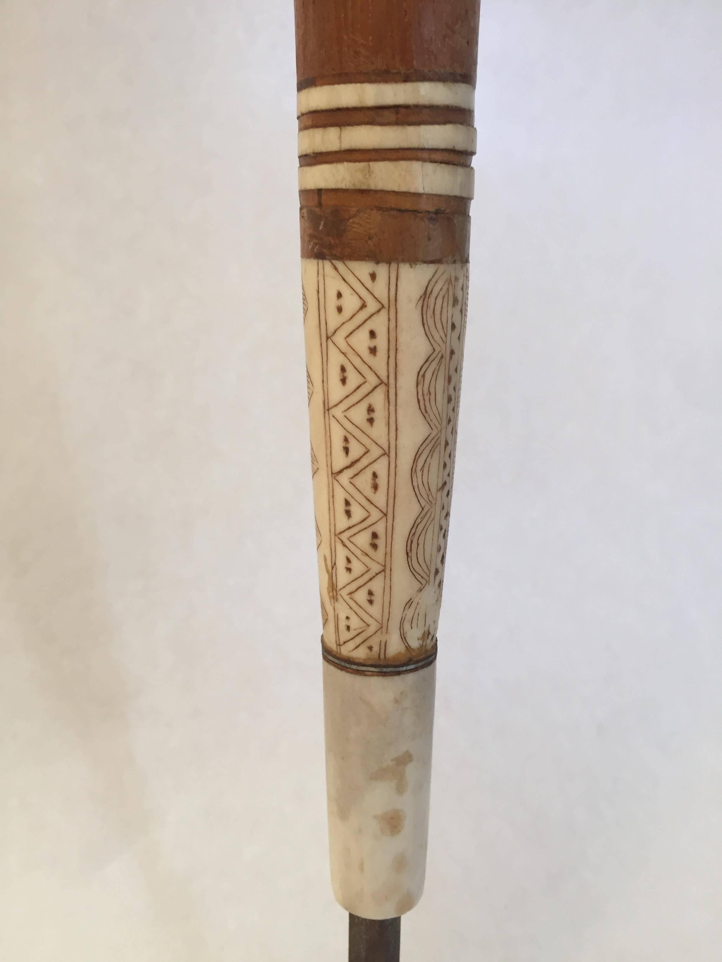 A beautiful piece of Swedish northern native Sami cultural history, a bear spear from the early 20th century made out of oakwood and reindeer horn, the reindeer horn is intricately carved in beautiful patterns along the whole spear.