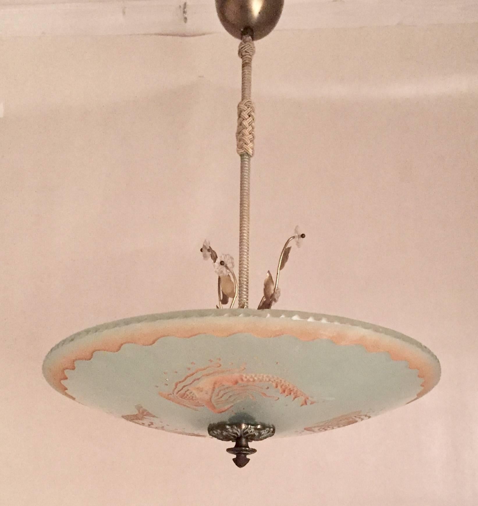 Swedish Art Deco 1935 Orrefors mermaid glass pendant lamp chandelier
A very beautiful Swedish art deco pendant lamp with three mermaids swimming in a circle painted and etched into the raw glass shade. A beautiful piece of Swedish high quality art