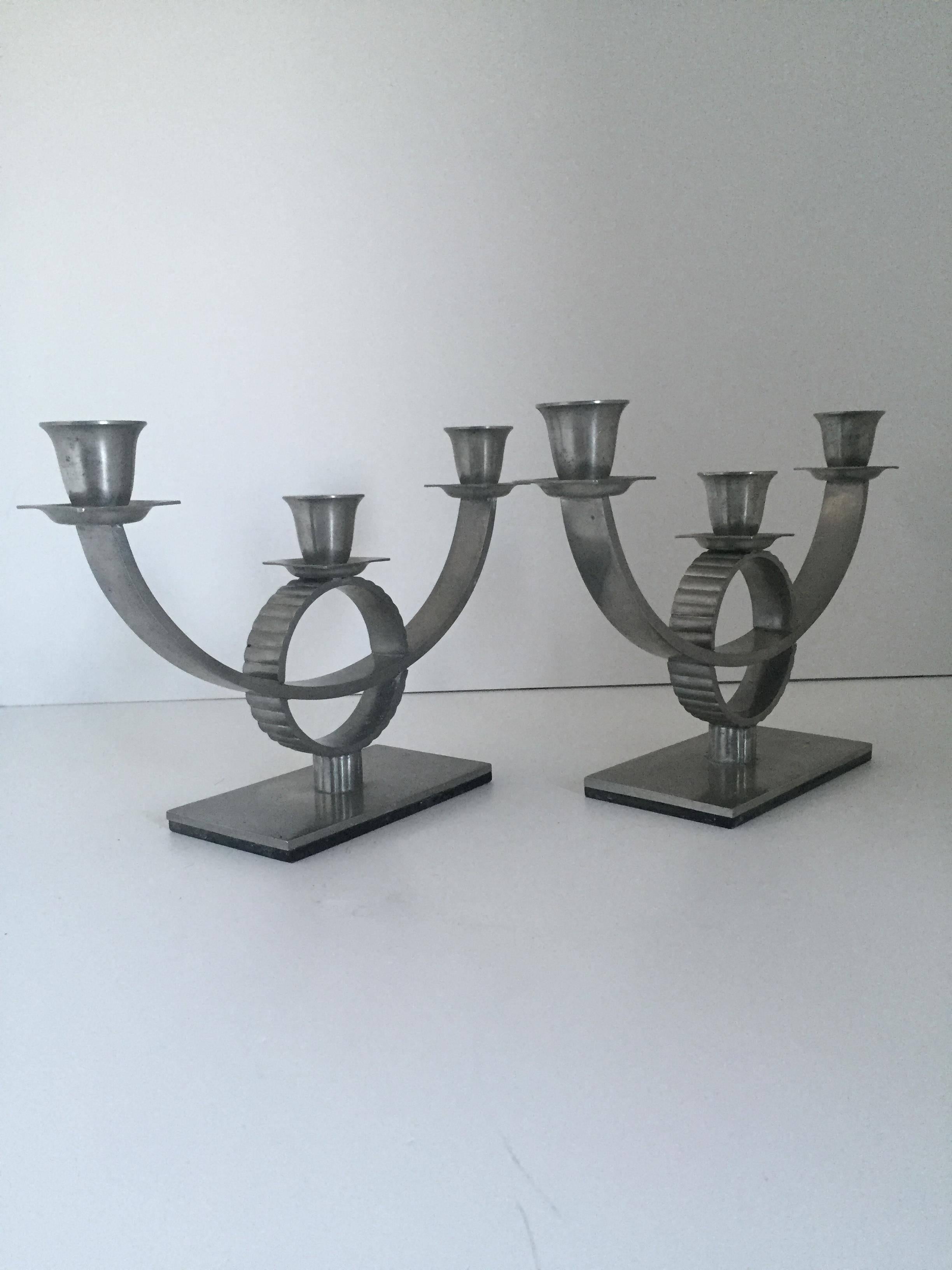 A rare pair of Swedish grace Art Deco period pewter candelabra. Very well cast and of high quality period pieces. They measure 26.5 cm wide and 17.5 cm in height. They are in a very nice condition without any repairs or dents.