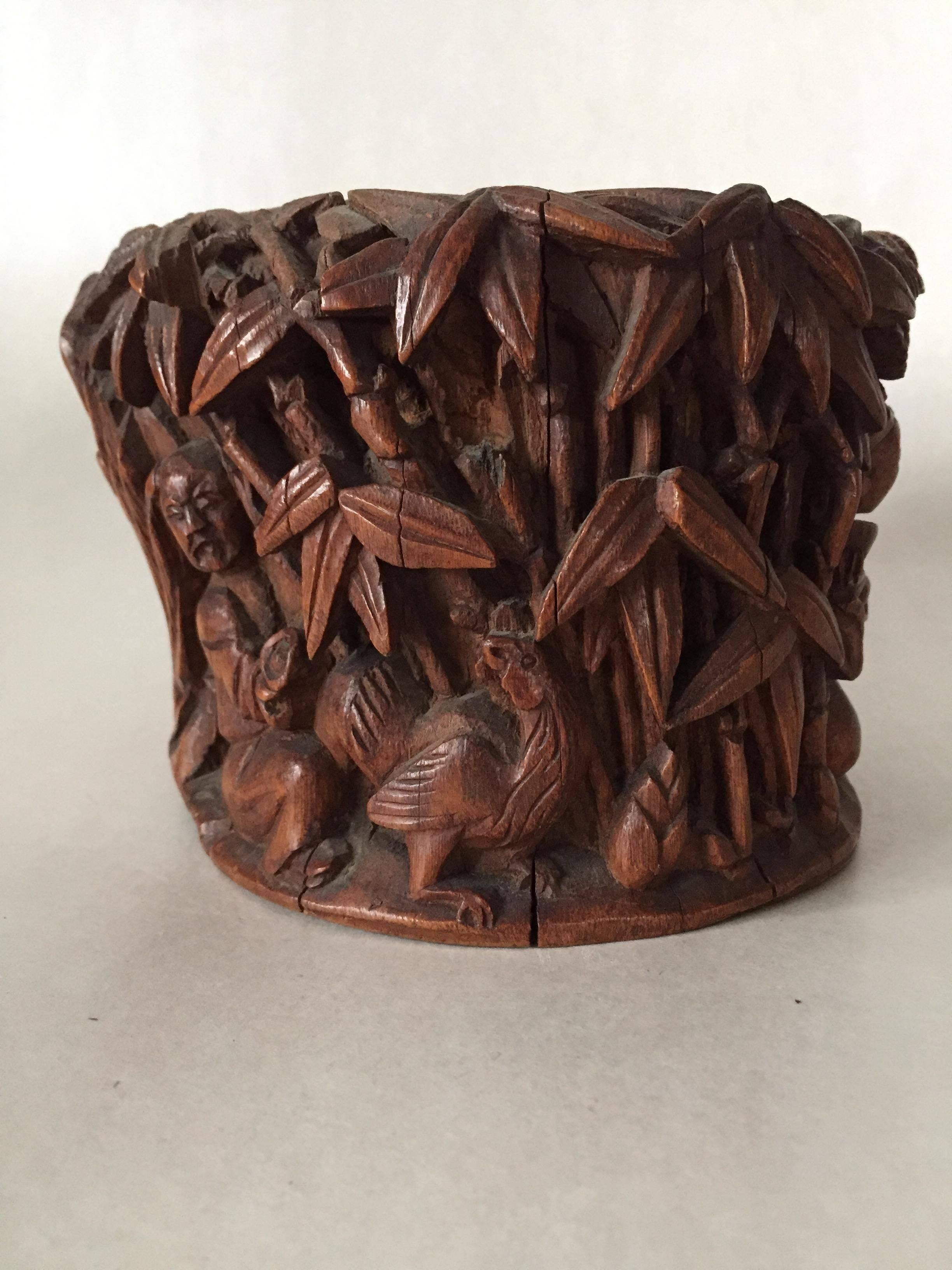 A nice 19th century large Chinese carved bamboo Brushpot depicting men and animals among bamboo and pine trees. A very nicely carved pot, the condition is fine with only three small chips on some leaf and some cracks along the side, please see