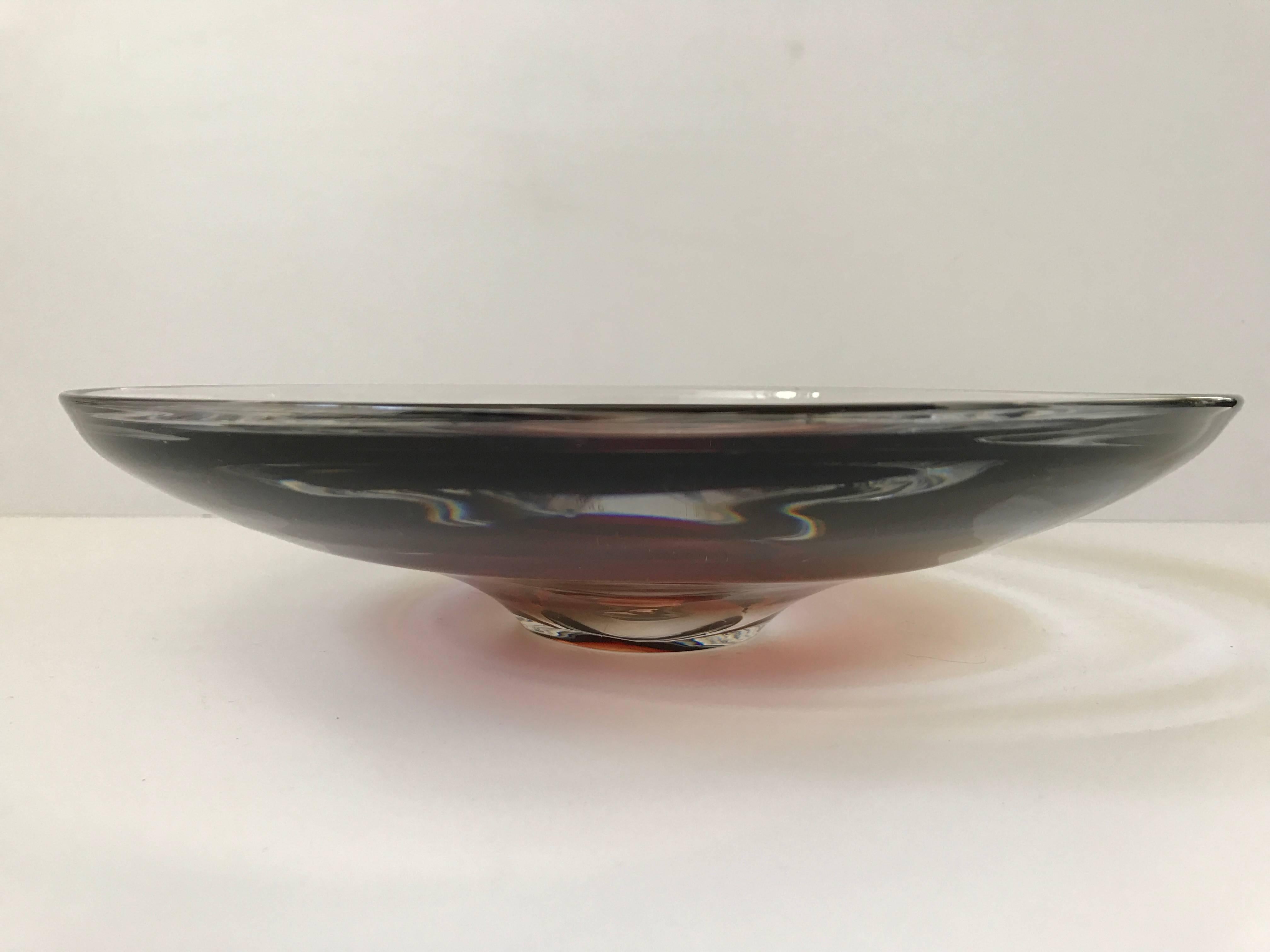 Mid-20th century Orrefors Swedish glass dish or bowl made, circa 1950. This beautiful glass dish or bowl is marked "Orrefors nr 4085" but not marked with makers signature. It has a wonderful strong red color and is shaped nicely to