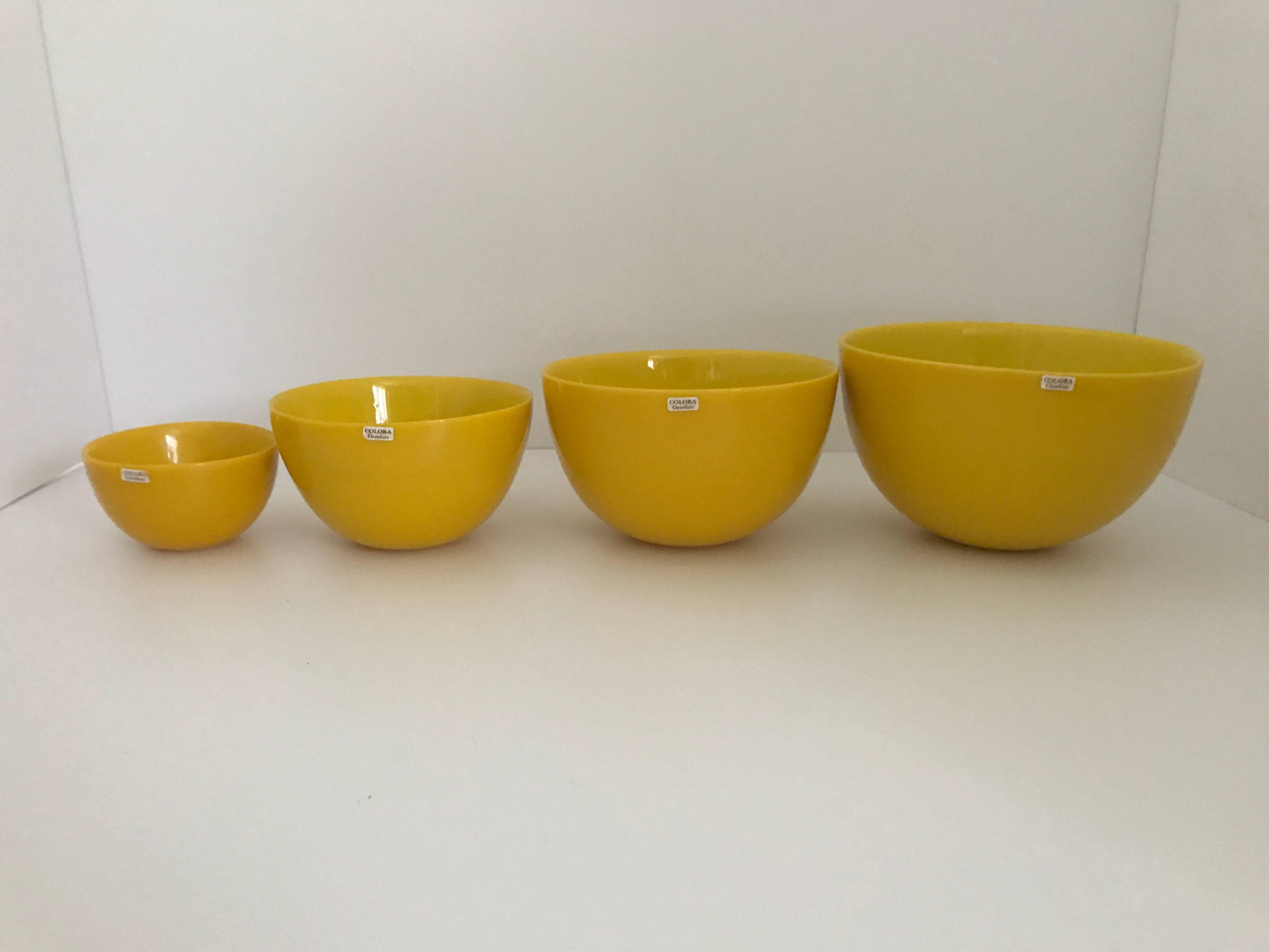 Mid-20th century Swedish Orrefors colora bowls four pieces set Sven Palmqvist.
This four piece set of serving bowls is in its original box and the bowls are in fantastic original condition. They are most likely made somewhere around 1960 in