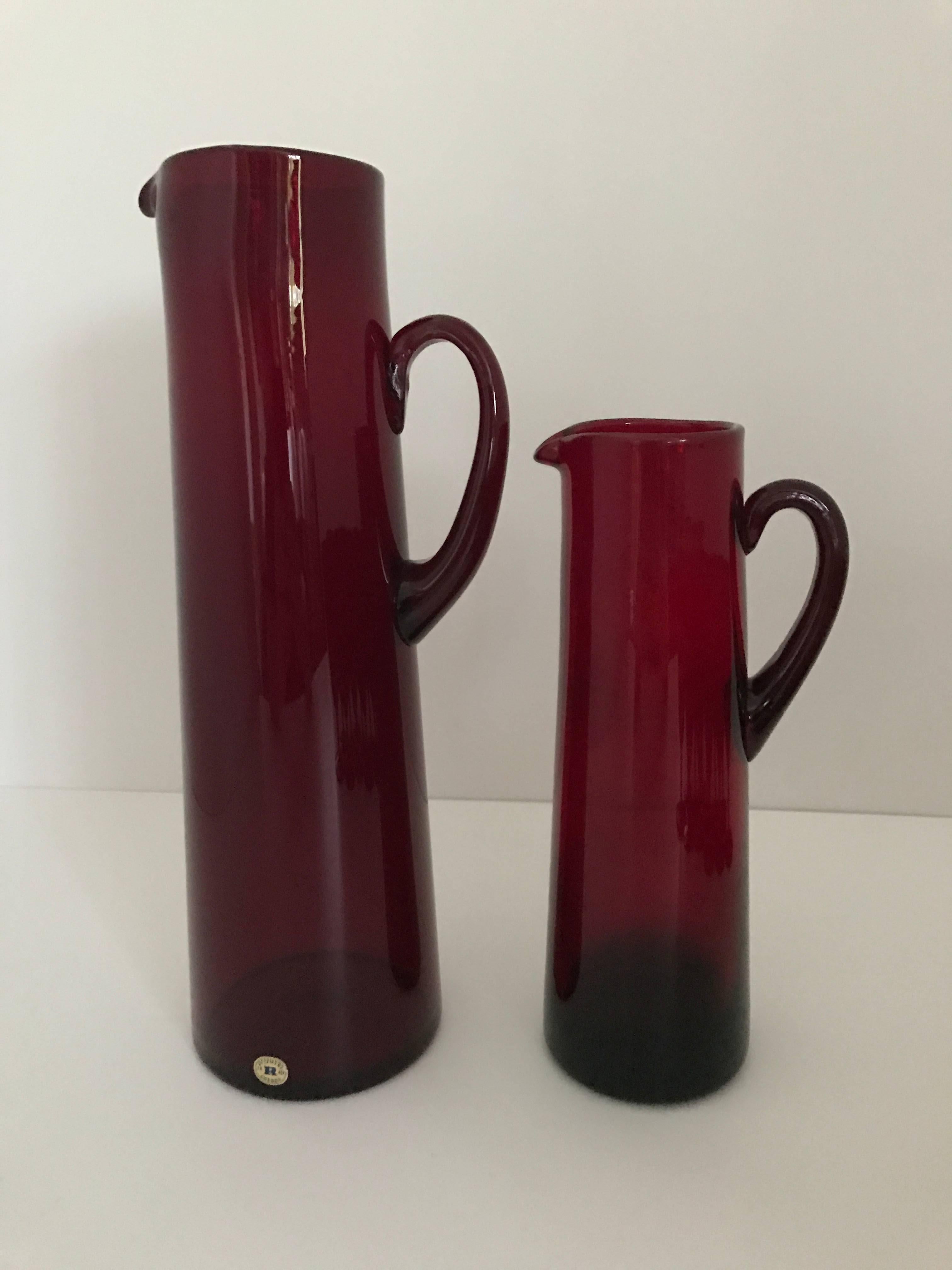 1960 Monica Bratt Reijmyre Glass Set of two Pitchers and 12 Drinking Glass.
A fantastic set of two different sized pitchers and 12 drinking glasses designed by Monica Bratt at Reimyre Glasbruk. Monica Bratt is very famous and popular for this