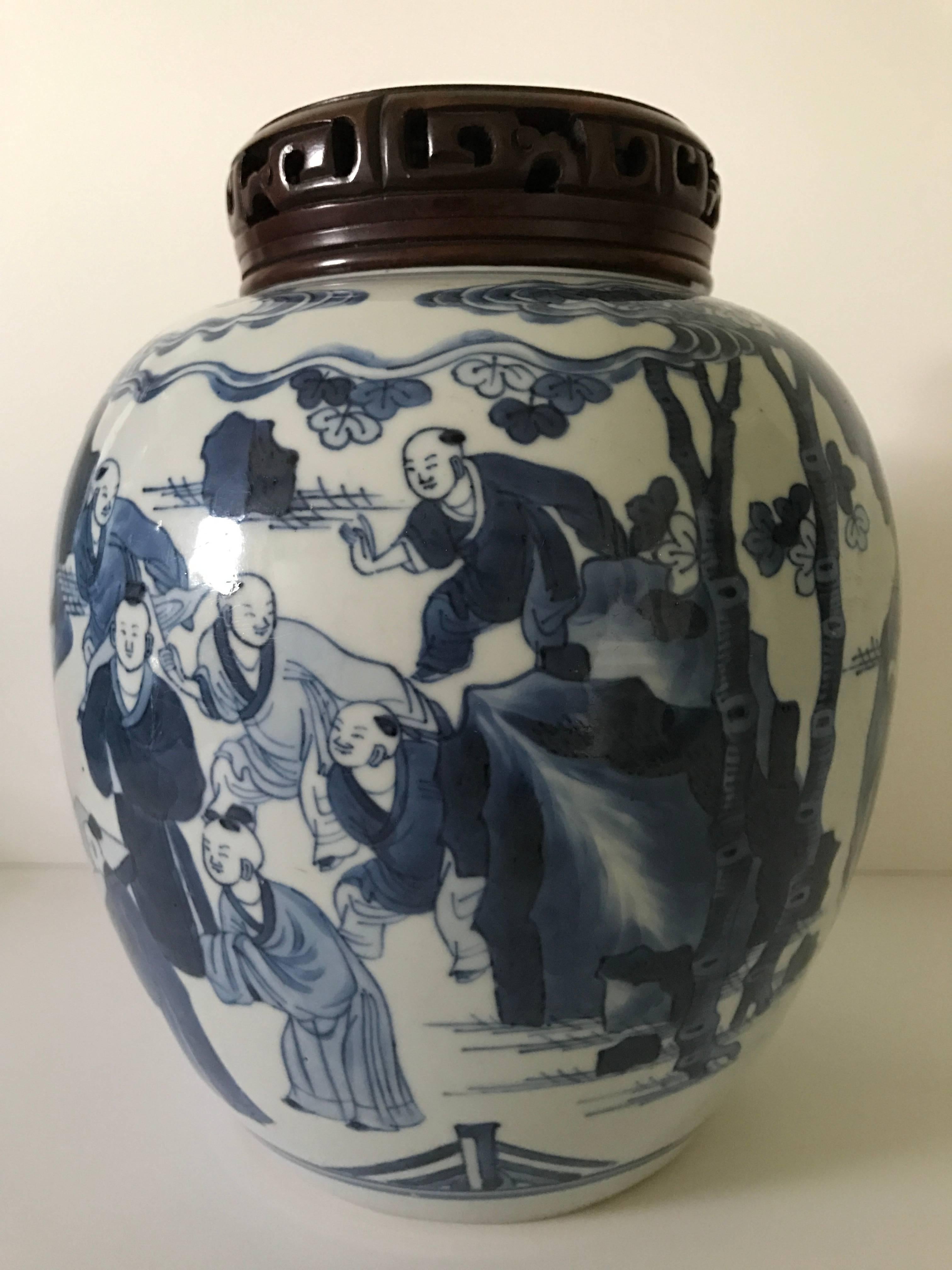 Late 17th century Kangxi 1662-1722 period jar with wooden lid.
A very nice blue and white Kangxi period jar depicting playing boys and four ladies. The mouth of the jar has been professionally restored, but most likely because large chips, there