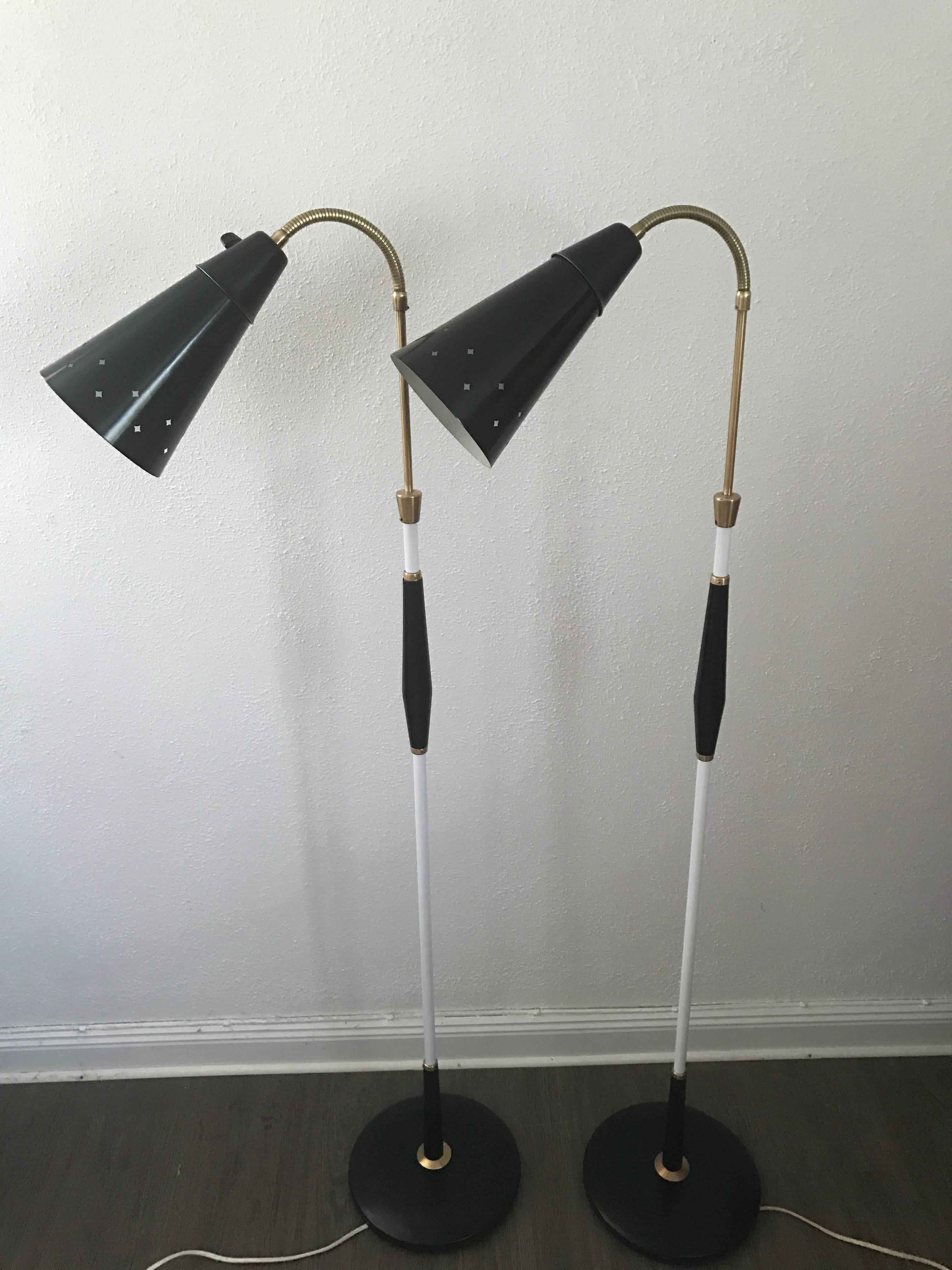 Pair of 1950 Swedish Pagos floor lamps with flexible shades.
A nice pair of flexible floor lamps made of wood and metal. This pair has been restored and painted, they come with new wiring and cords, but the old switches are original and in a nice