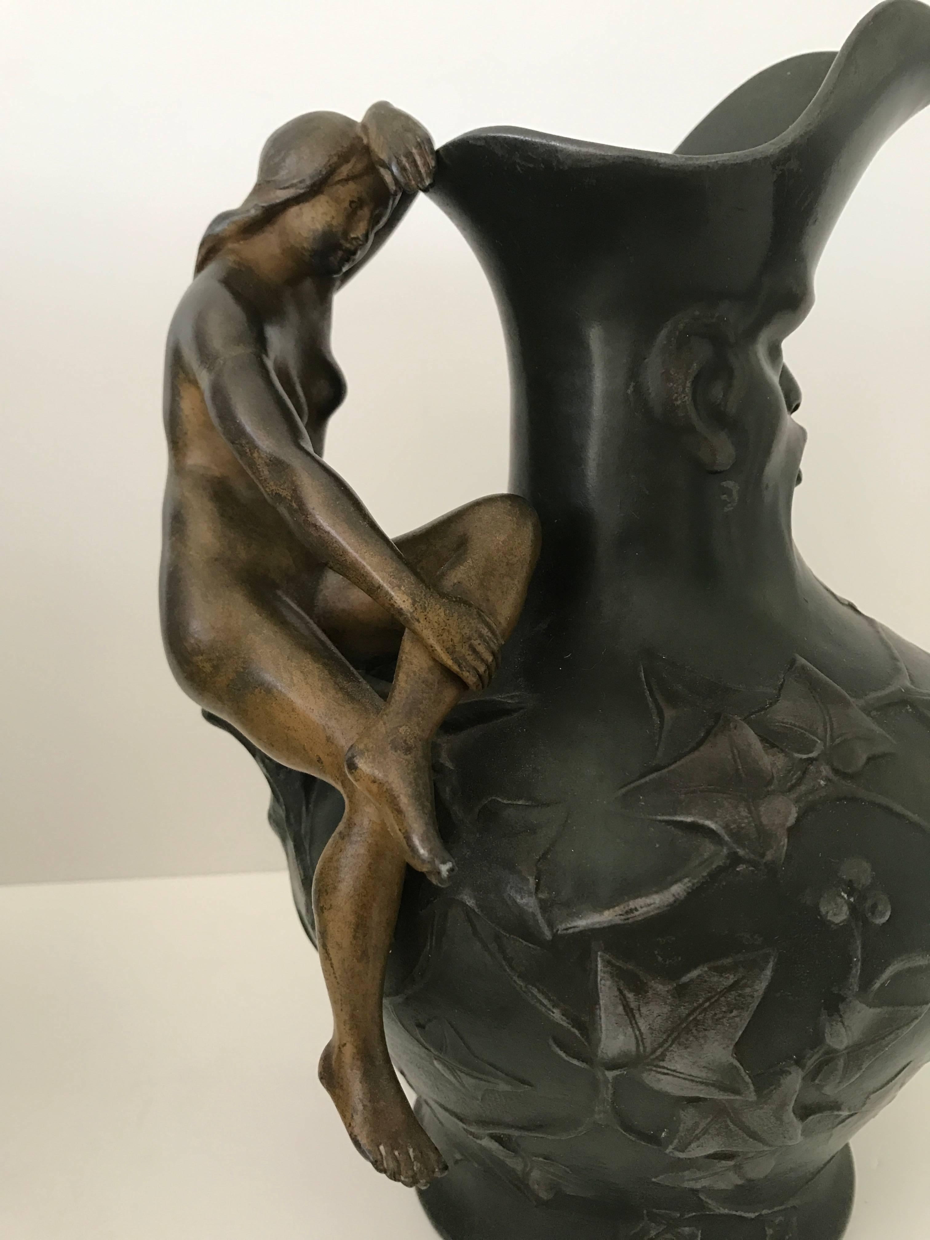 Late 19th century bronze patinated pewter pitchers Charles Théodore Perron.
Very nice pitchers made out of what we can believe, Pewter or some other metal, patinated as bronze. Two naked ladies as handles and a mans face on the neck and branches