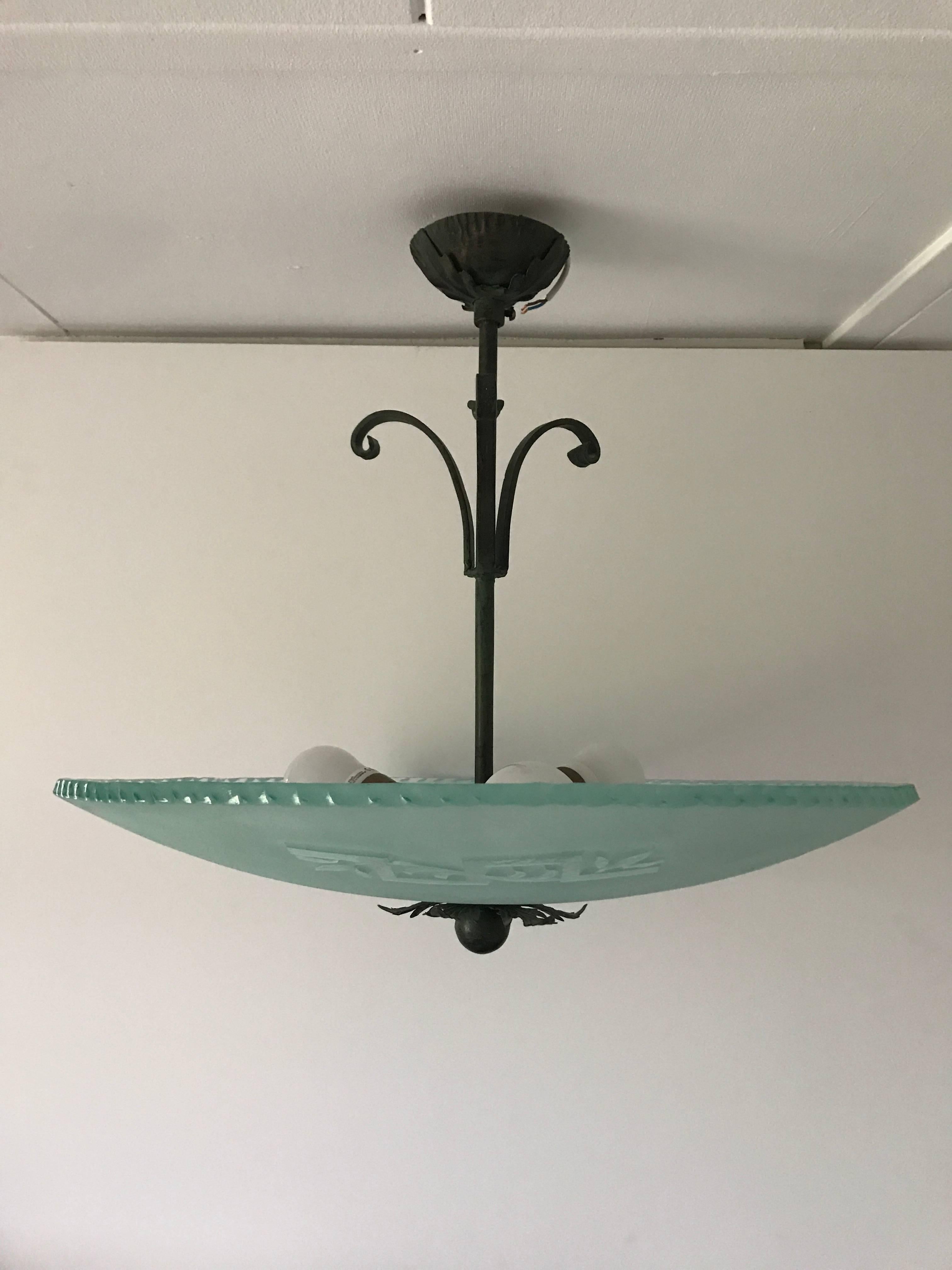1935 Art Deco Swedish frosted and etched glass pendant.
This beautiful pendant light fixture was most likely made at Orrefors in the south of Sweden. The beautiful frosted shade has an exquisite Art Deco pattern etched into it. The shade has a