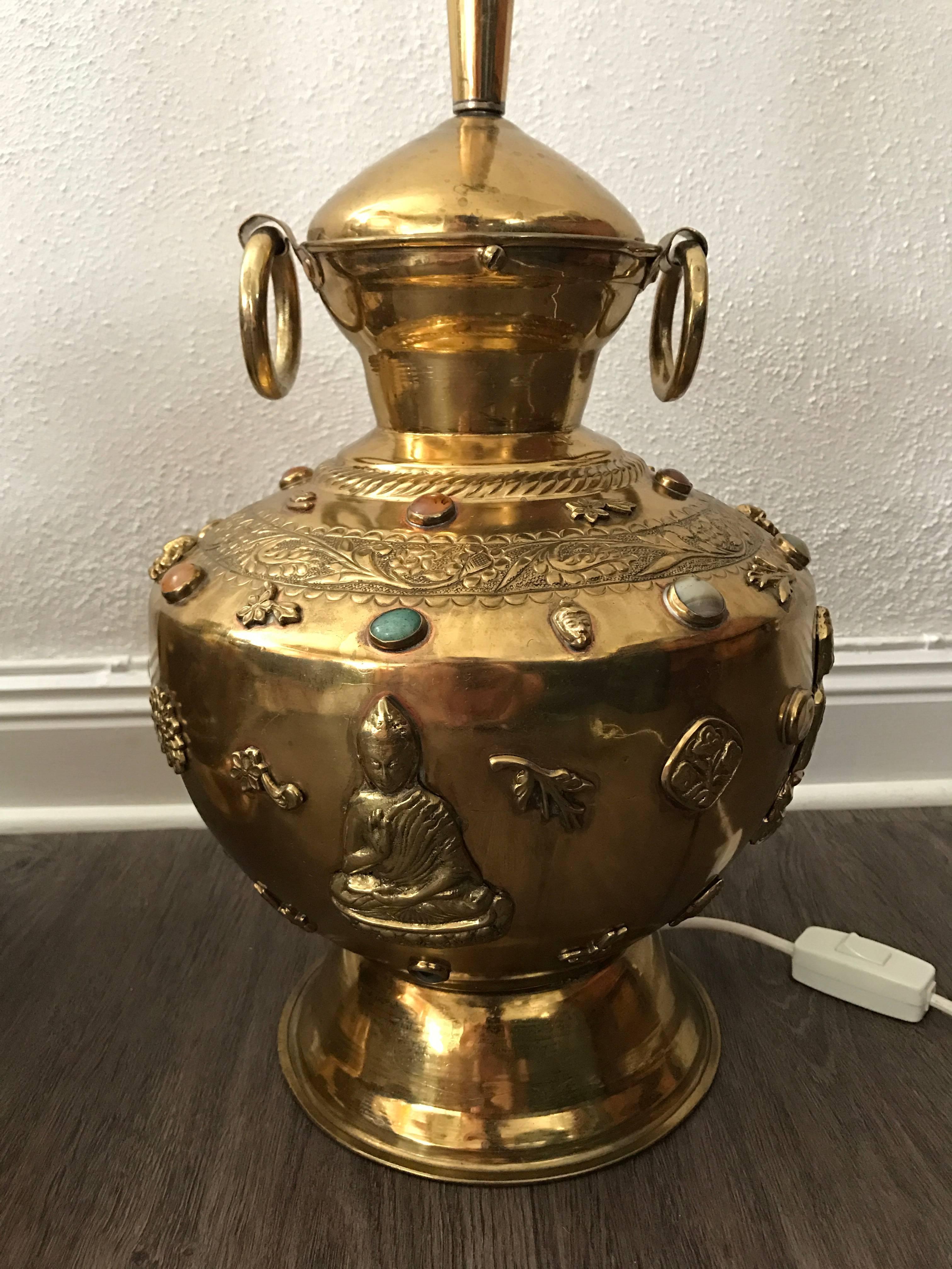 20th century pair of large Asian Buddha brass precious stones decorated table lamps a fantastic pair of beautifully decorated brass table lamps. There are precious stones, Buddha figures, chrysanthemum flowers, leaf and signs decorated all-over the