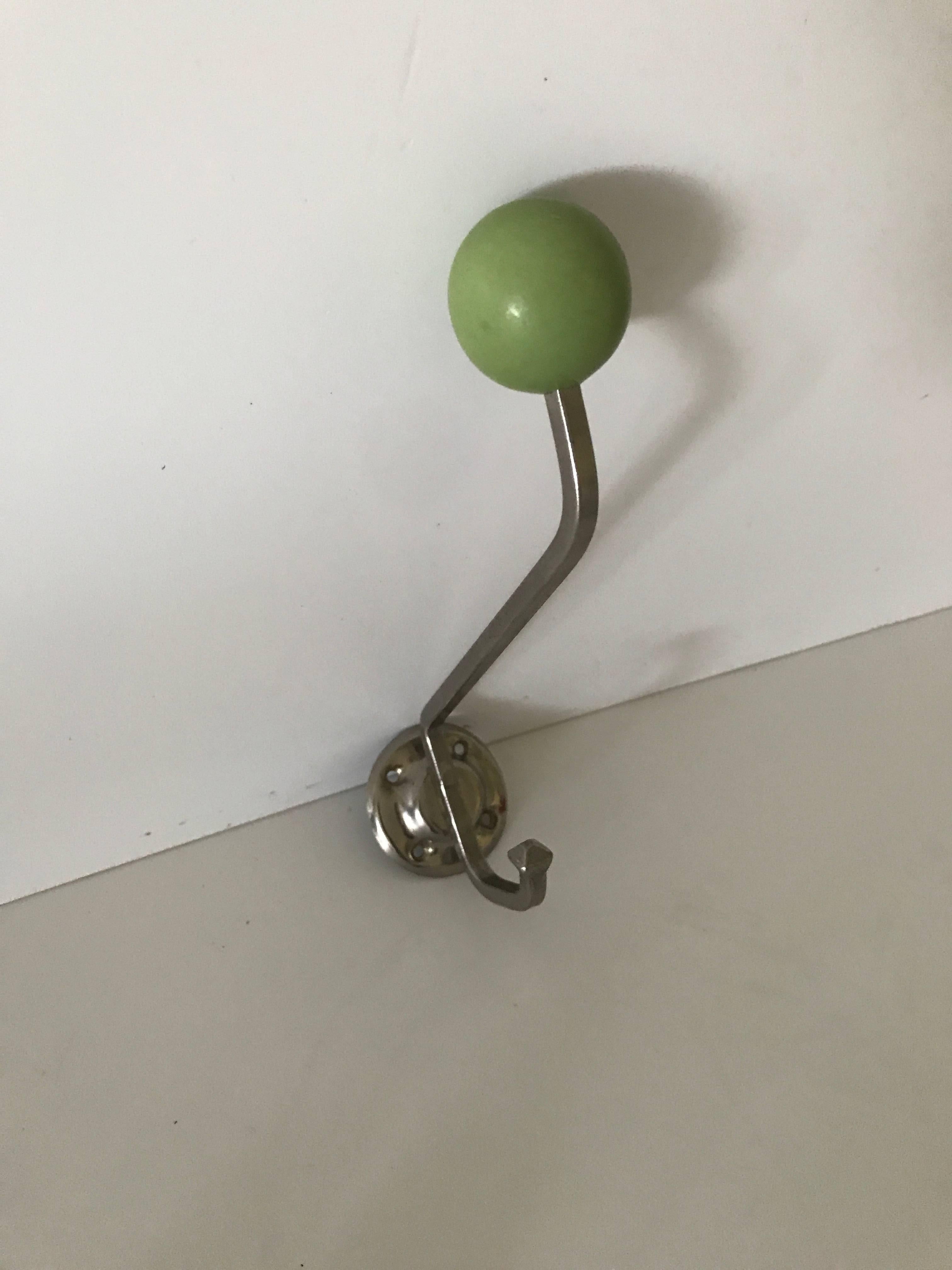 1930, Swedish Art Deco steel and Bakelite coat hangers.
Three beautiful coat hangers made of steel and a bakelite knob on top, they are in a nice original condition and without any cracks or damages. They measure 13cm out from the wall and 13cm in