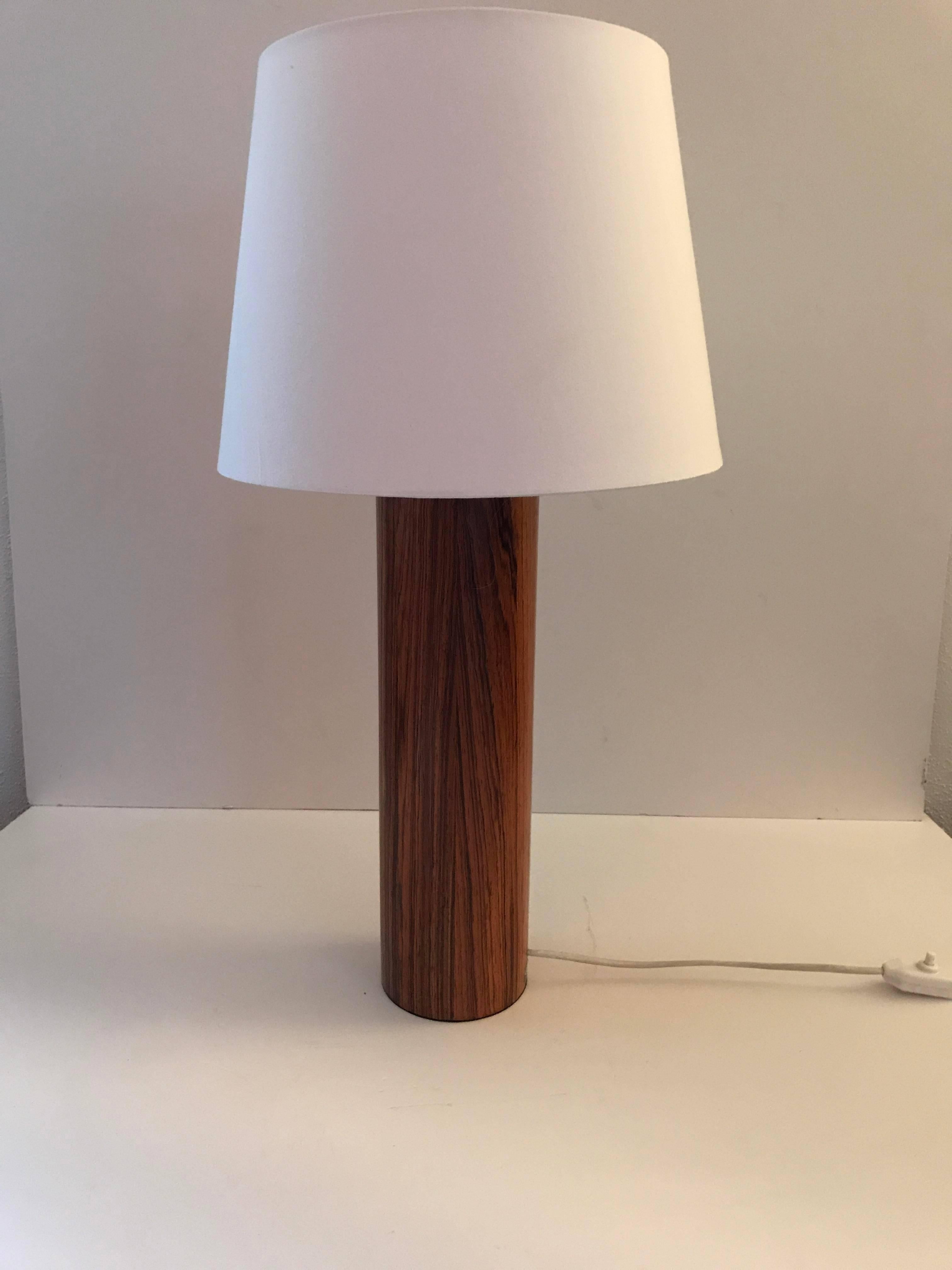 Large pair of Swedish Luxus rosewood table lamps by Uno & Östen Kristiansson.
A beautiful elegant pair of very large table lamps in very simple design, made of rosewood with a wooden color that is fantastic. These lamps were made by Luxus Sweden and