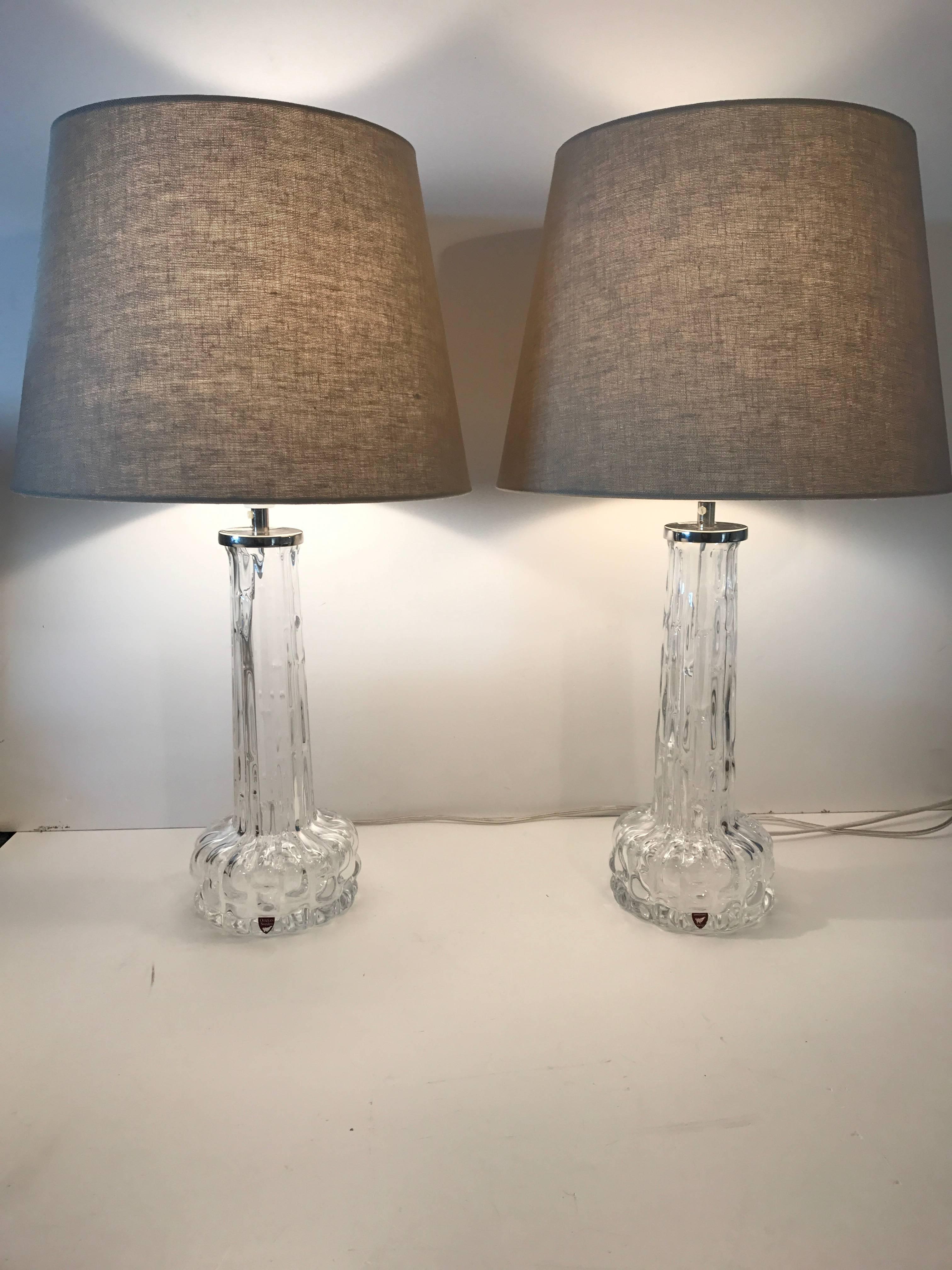 Swedish Orrefors 1955 art glass table lamps by Carl Fagerlund.
A beautiful pair of table lamps designed by Carl Fagerlund at Orrefors Sweden. This pair is in perfect condition without any damages. The height is 55cm and the diameter of the shade is