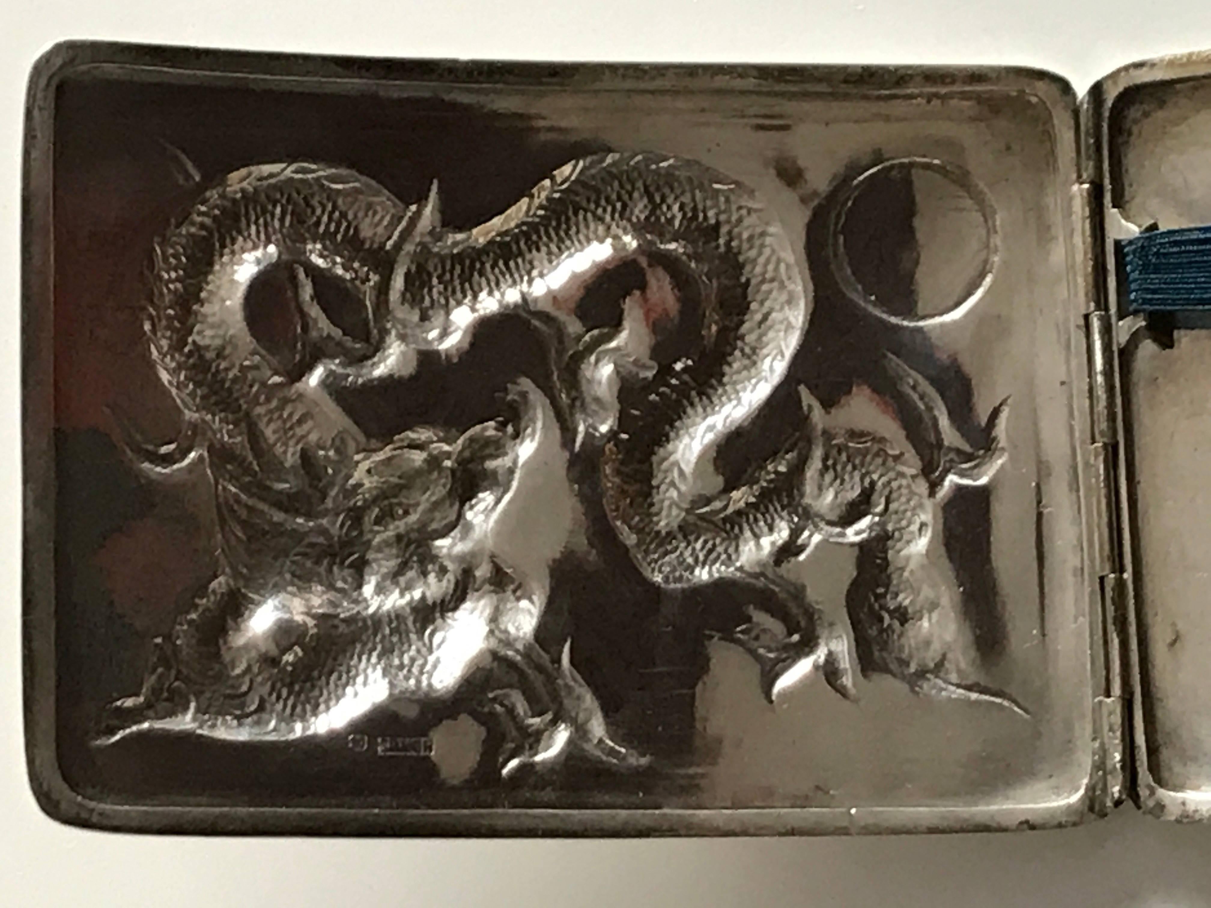 Chinese early 20th century export silver cigarette or card case 90% silver.
A beautiful and very high quality Chinese export silver cigarette case, depicting a dragon. The case has a small circle that normally is engraved but this rare example is