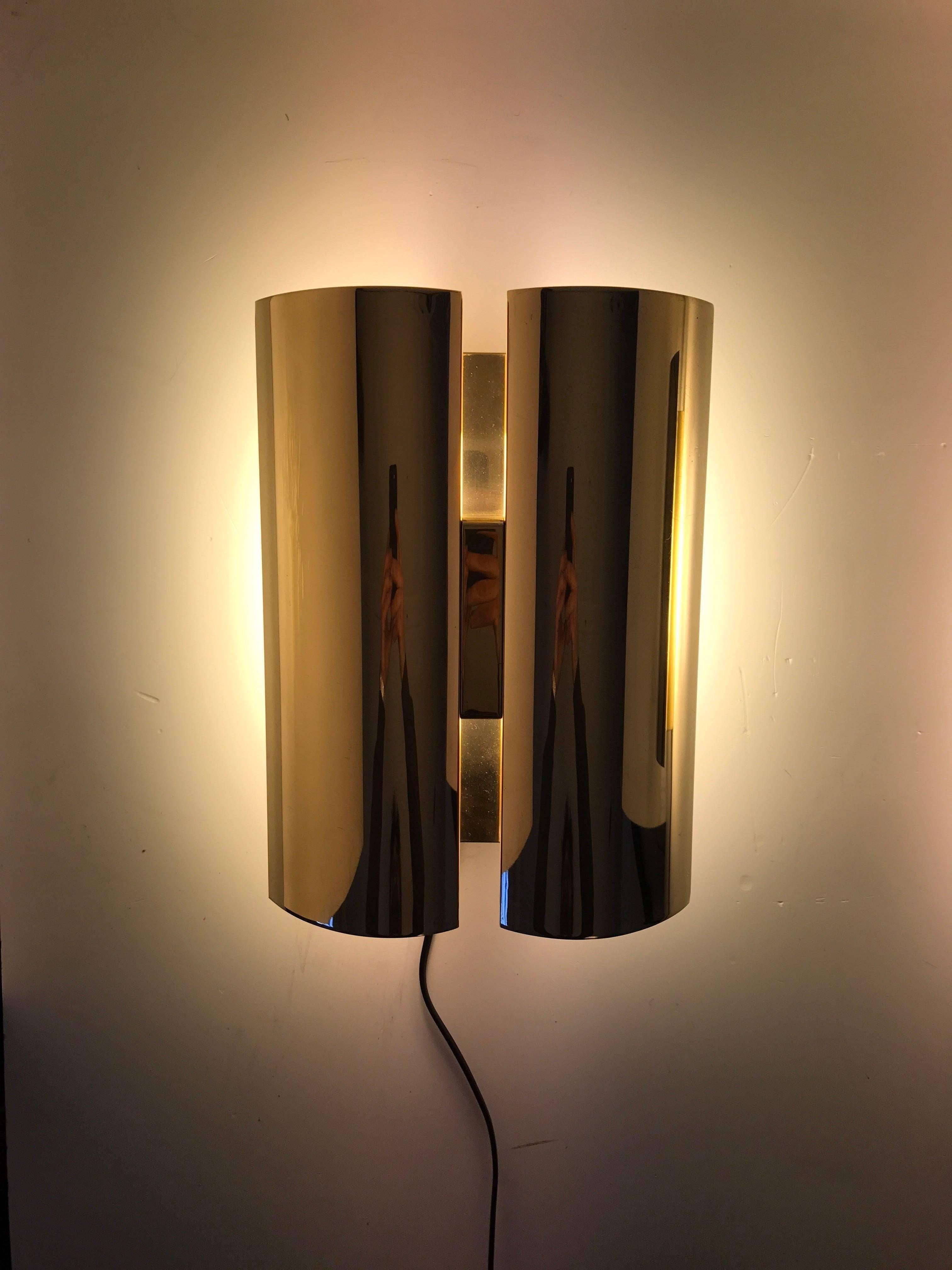 Rare Pair Swedish Fagerhult Brass Wall Sconces Late 20th Century.
A beautiful and rare pair wall sconces made by Fagerhult Belysning AB. The sconces have compact fluorescent tubes 2pin G23 socket. New in box extra flourescent tubes will come extra