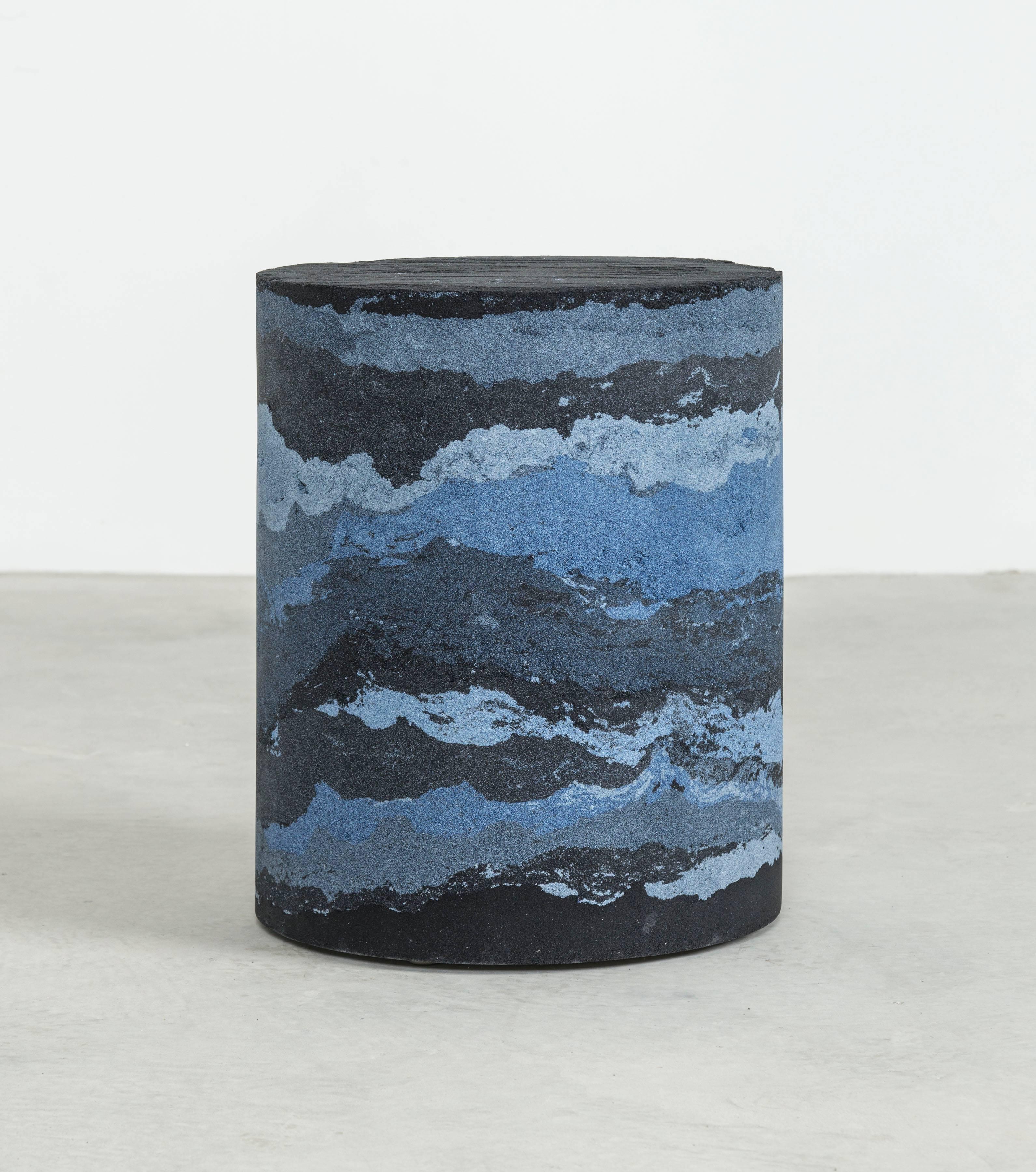 Inspired by the layers of the earth, the made-to-order drum is solid and cast from hand-dyed black silica, crushed glass, powdered glass, crystal quartz and sand. Packed in layers, the raw edges are hand-carved in natural undulations to create an