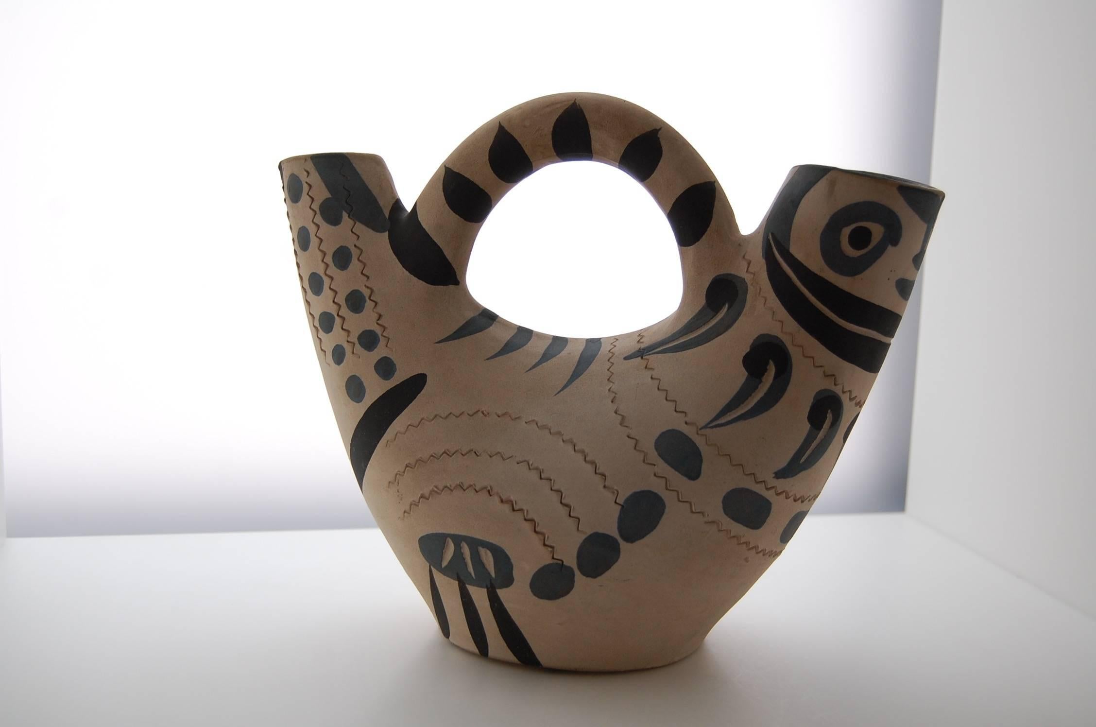 This big ceramic pitcher was designed by Pablo Picasso (1881-1973) in 1954. The Madoura workshop of Georges and Suzanne Ramie were executing these dramatic new ceramic designs which renewed the pottery making craft in the whole village of Vallauris