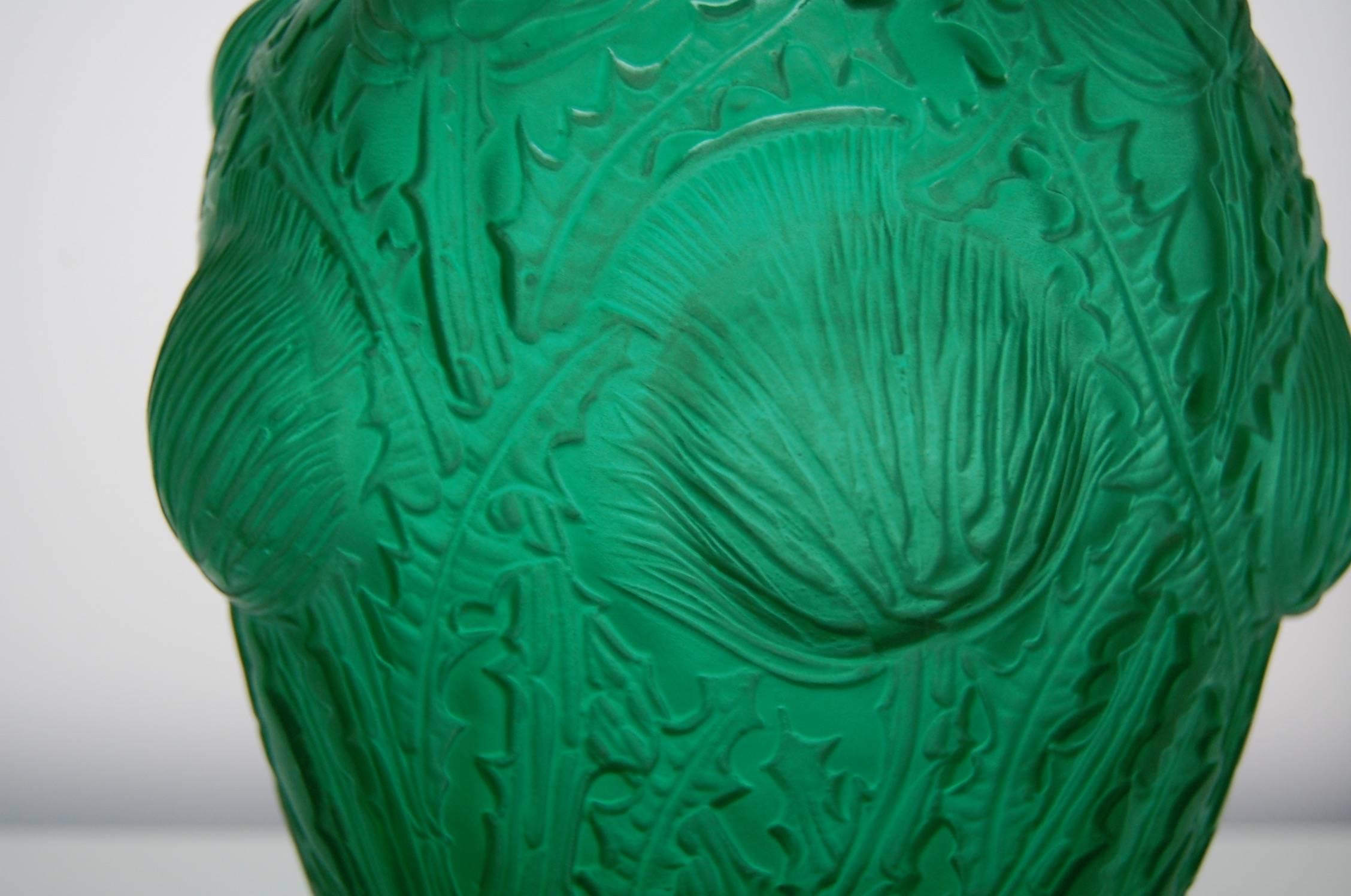 This beautiful big vase is rarely seen in this green color. The green glass makes it lively, the molding is crisp and the pattern gives the vase its majestic look. The condition is excellent, signed in script ‘R. Lalique France.’

Measures: Height