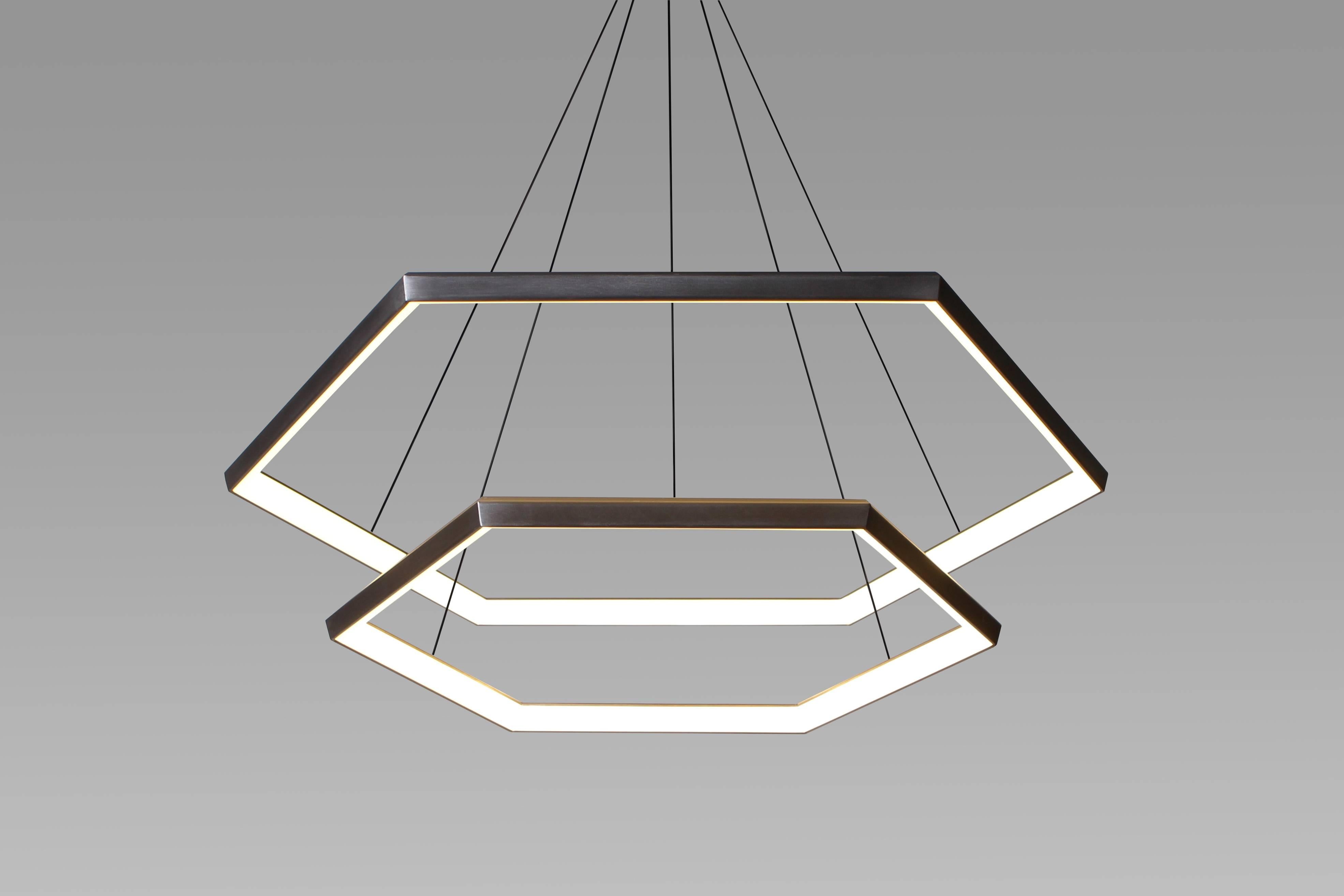 HEXIA CASCADE HXC46 is the beautiful meeting of the HEXIA line. Suspended effortlessly one above the other, convex hexagonal forms create a sleek and modern chandelier.

Metal Finish
Powder-coat finishes available in Metallic Gold Powder-coat,