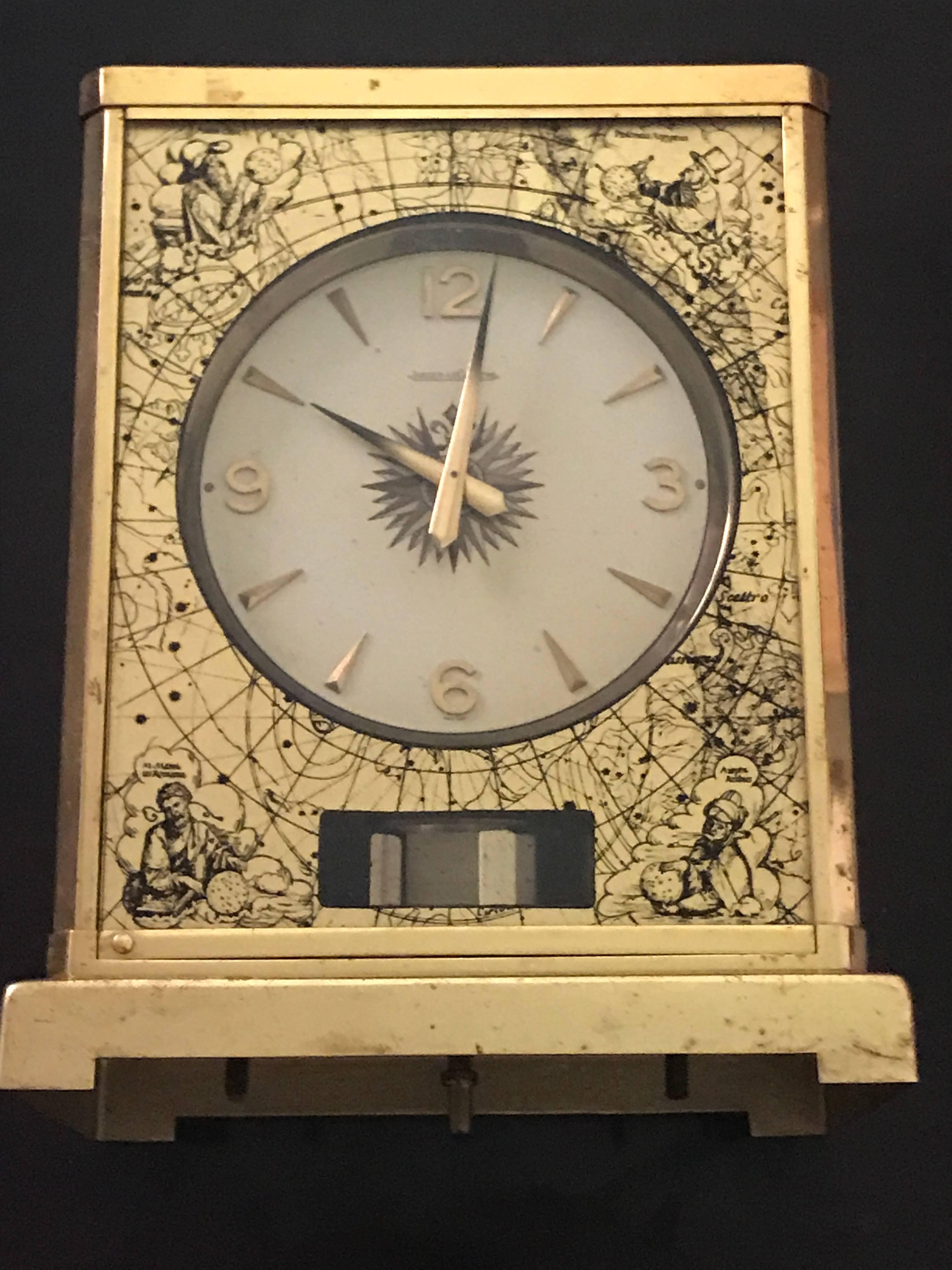 A very rare skymap 1950s Jaeger Le Coultre Classic model Swiss Atmos clock with box, 526/5, circa 1950.
Golden brass case with pictures of the astronomical sky according to ancient Greeks. It comes with its original white parchment and blue velvet