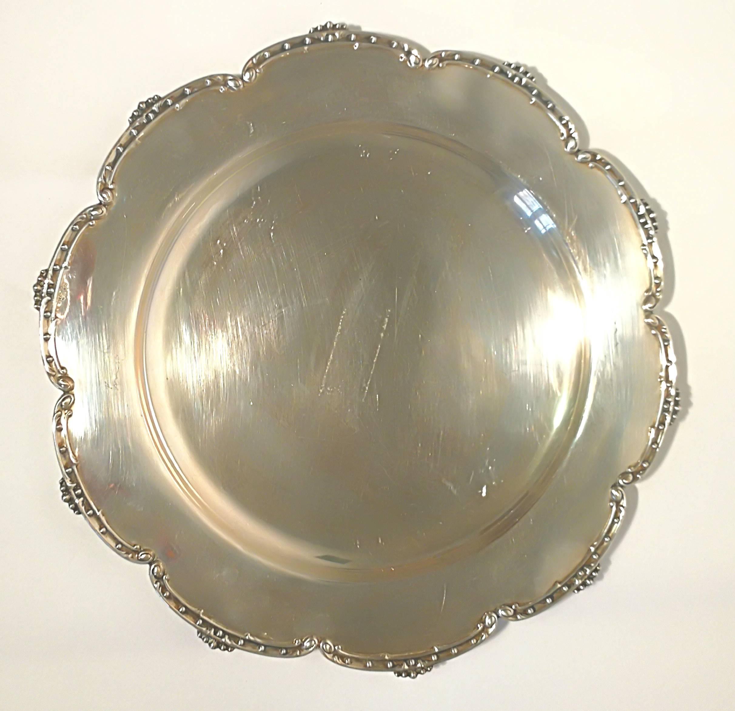 Very nice silver dish plate. With silver decorations.