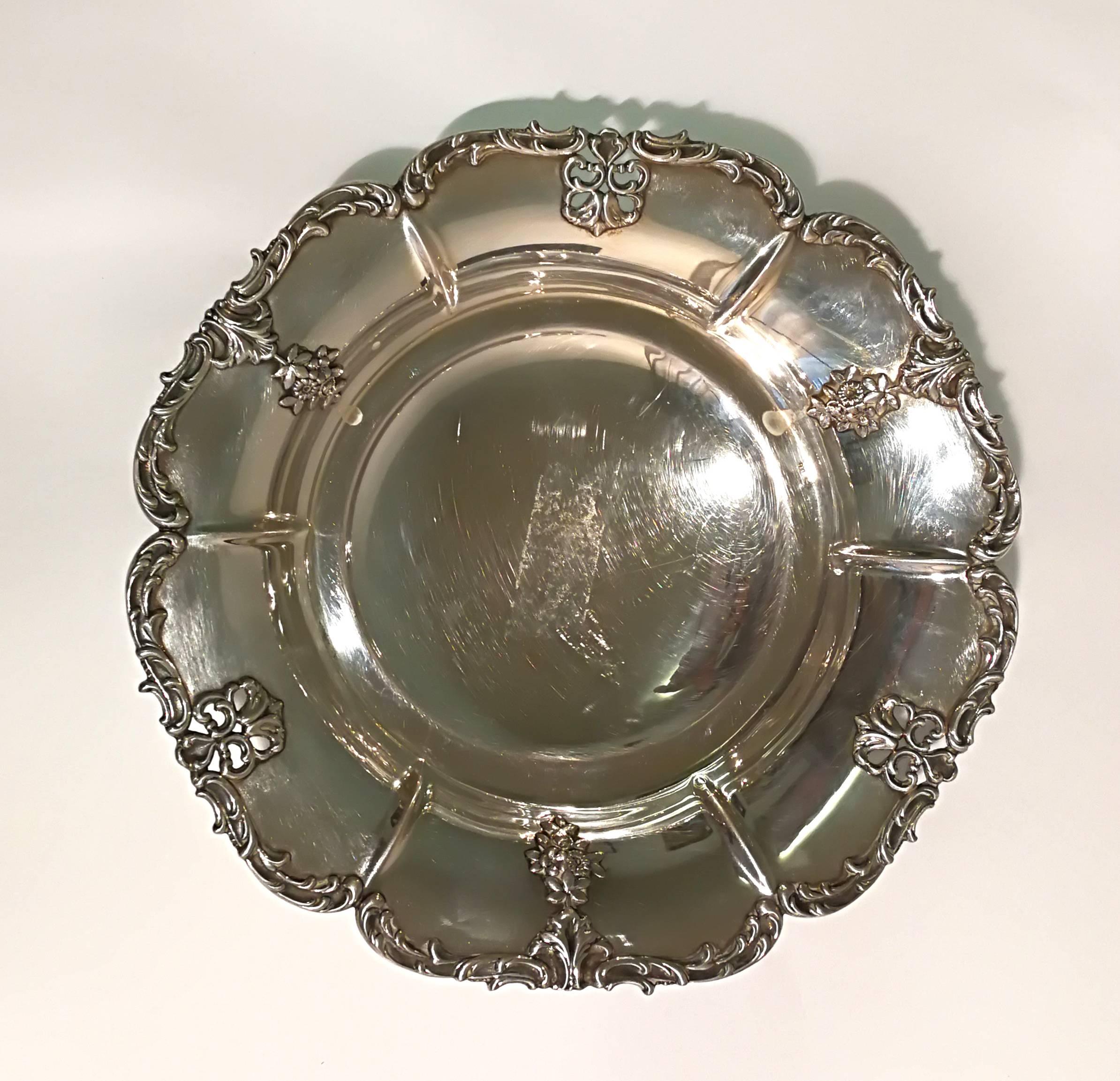 Round shaped silver chiseled centerpiece. Little tape stains. 