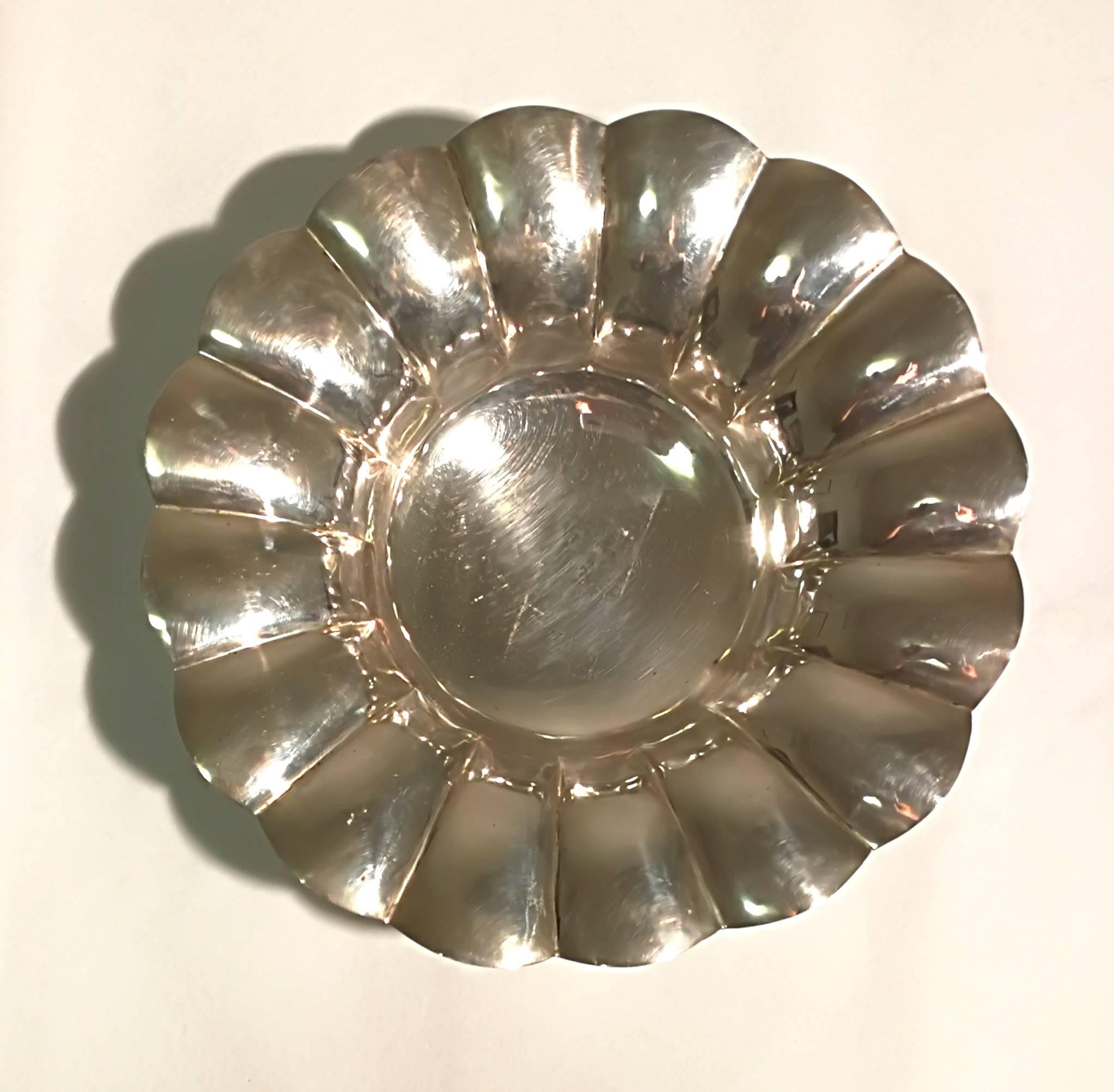 Nice round silver centrepiece embossed. Nice piece in good conditions but with tape stains.