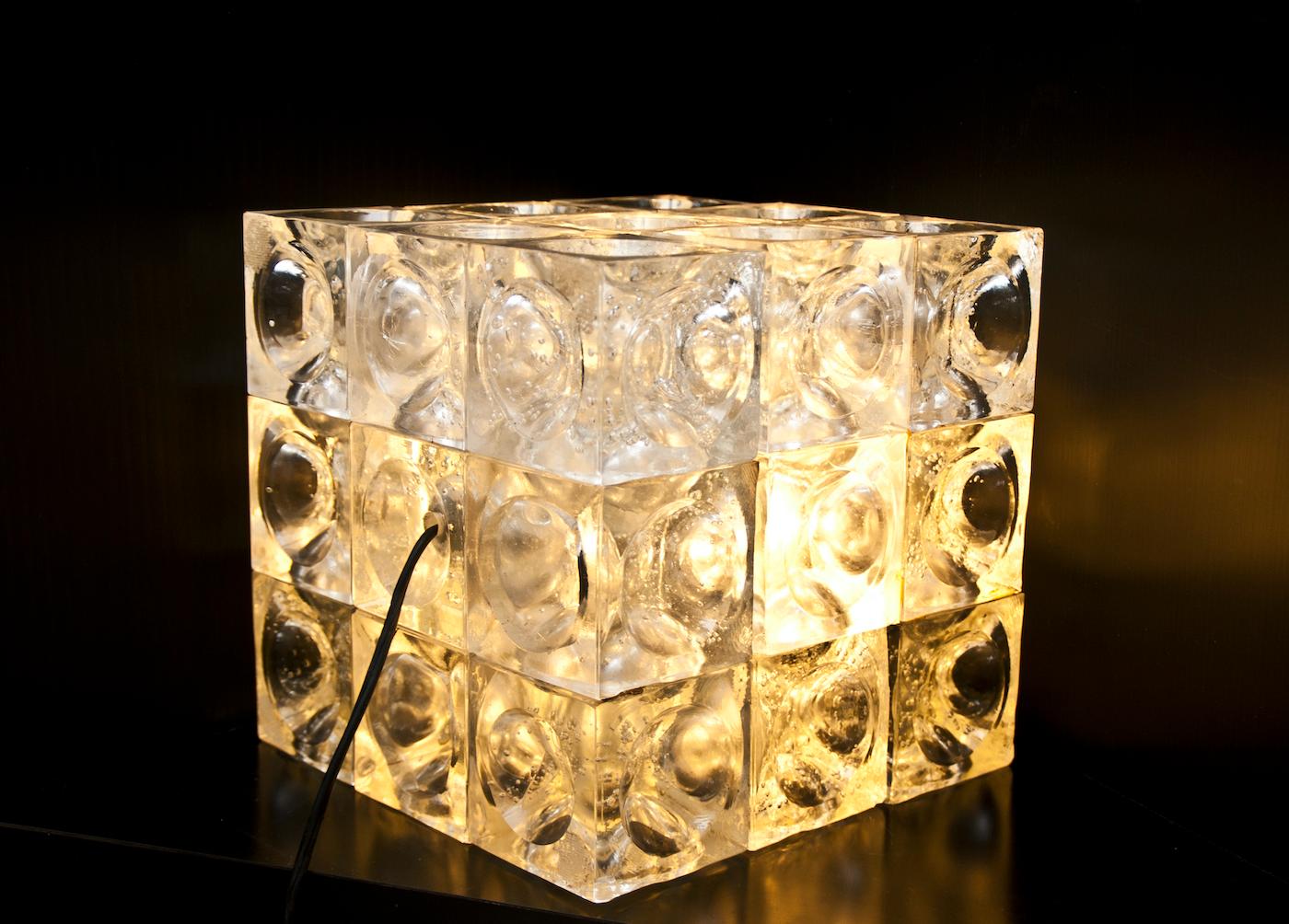 Sculptural Italian glass cube lamp designed by Poliarte.

Poliarte was one of the leading Italian lighting manufacturers during the 1960s and early 1970s.

At the beginning of the 1960s, Albano Poli created the Poliarte brand and reinvented