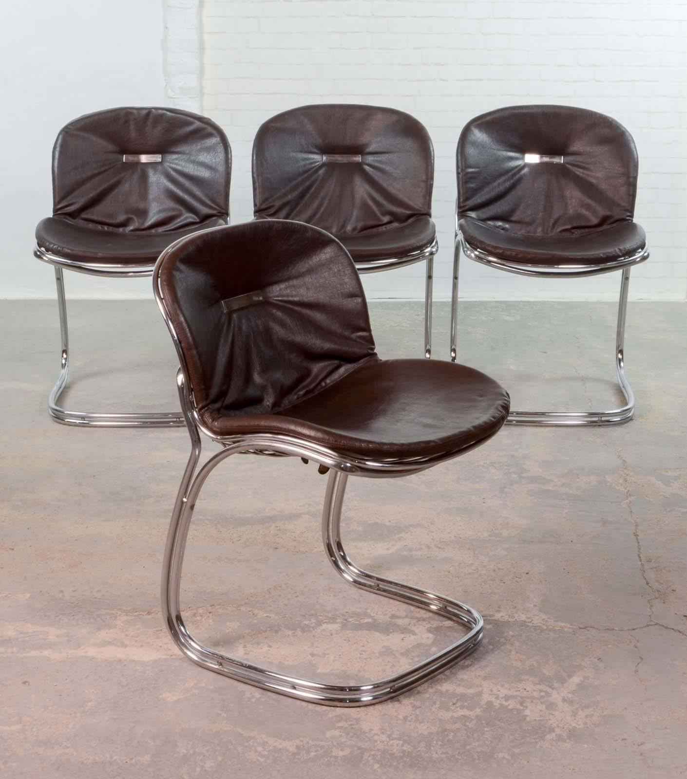 This set of four 'Sabrina' chrome steel wire chairs were designed by Gastone Rinaldi for RIMA in Padove, Italy, during the 1970s. The cantilevered chairs feature chromed tubular steel frames and cushions covered with dark brown leatherette,