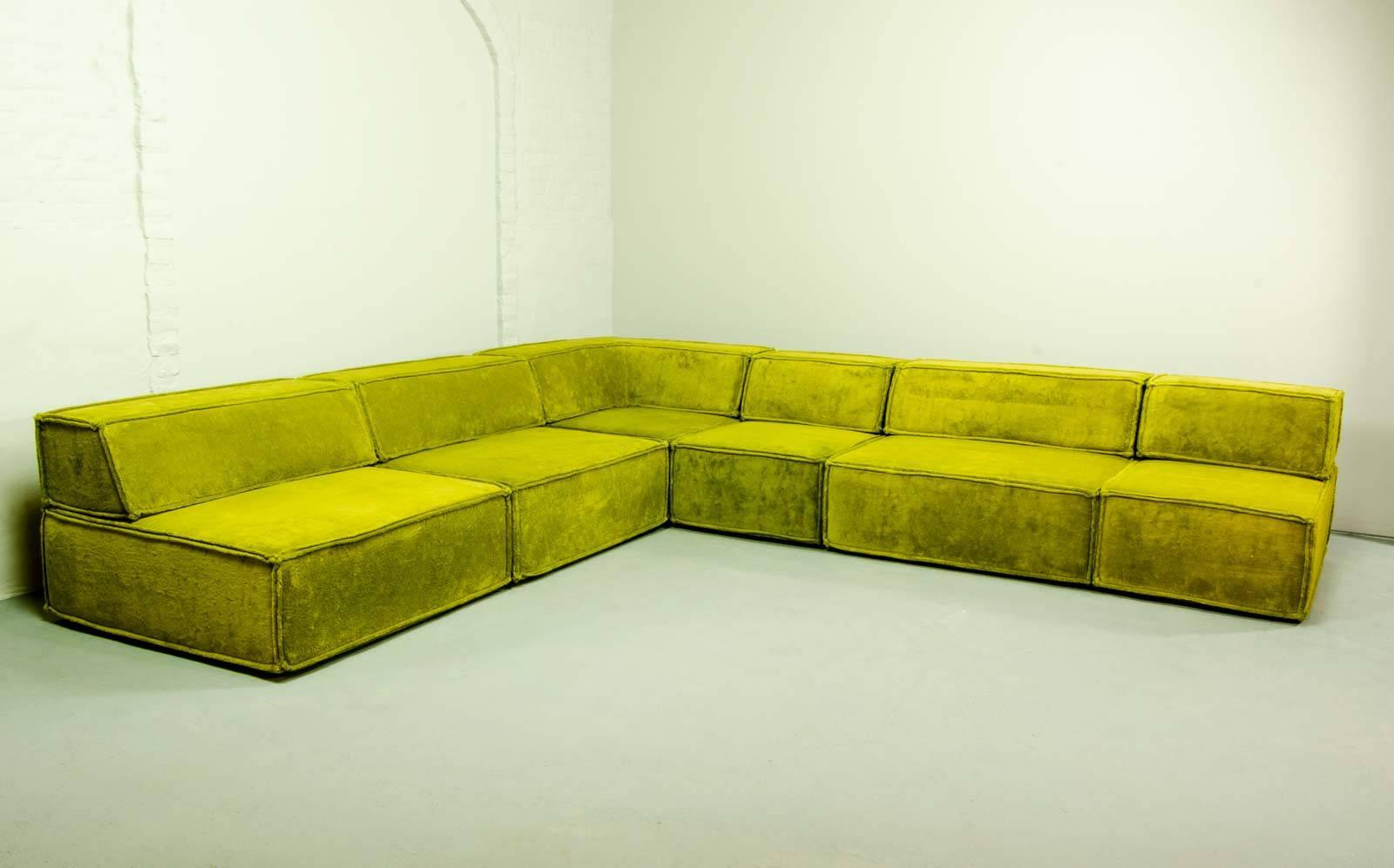 Beautiful and high quality COR trio modular lounge Sofaset by Team Form AG. Designed and developed in the 1970s with subtle soft velvet avocado green upholstery. This large seating group consists of 6 elements (4 square and 2 rectangular) including