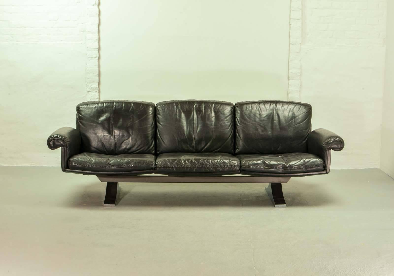 Highly desirable DS35 black leather three-seat sofa, built by De Sede, Switzerland in the late 1960s. This high quality sofa guarantees a great seating comfort and is upholstered in a beautiful soft black leather with superb whipstitch edge detail.