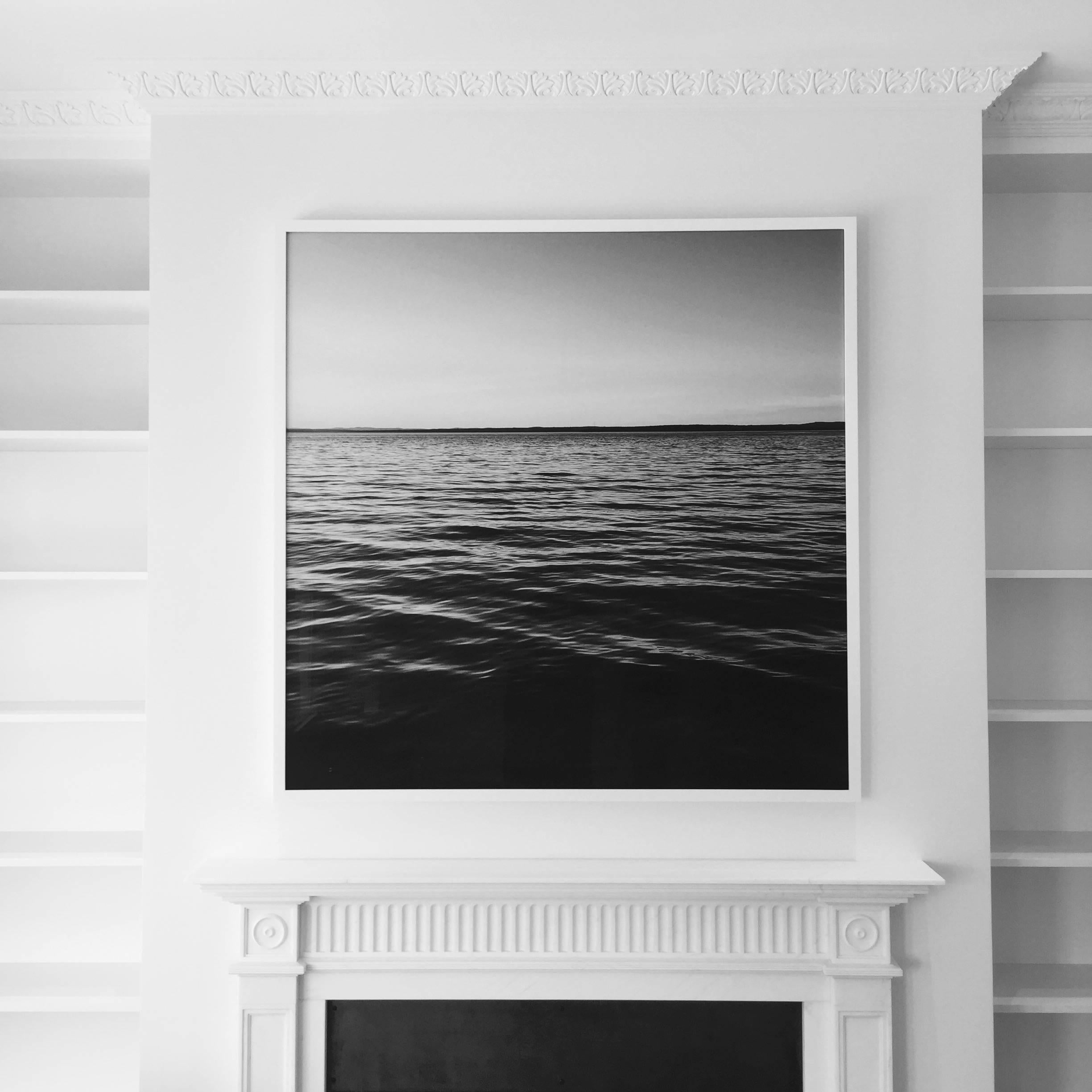 Black and white photograph printed on rag paper. Taken by Grant K. Gibson on Penobscot Bay in Maine. This contemporary piece will add depth and sophistication to any space. 

Note: Framing is not included. Measures: 48 in. x 48 in. Custom sizes