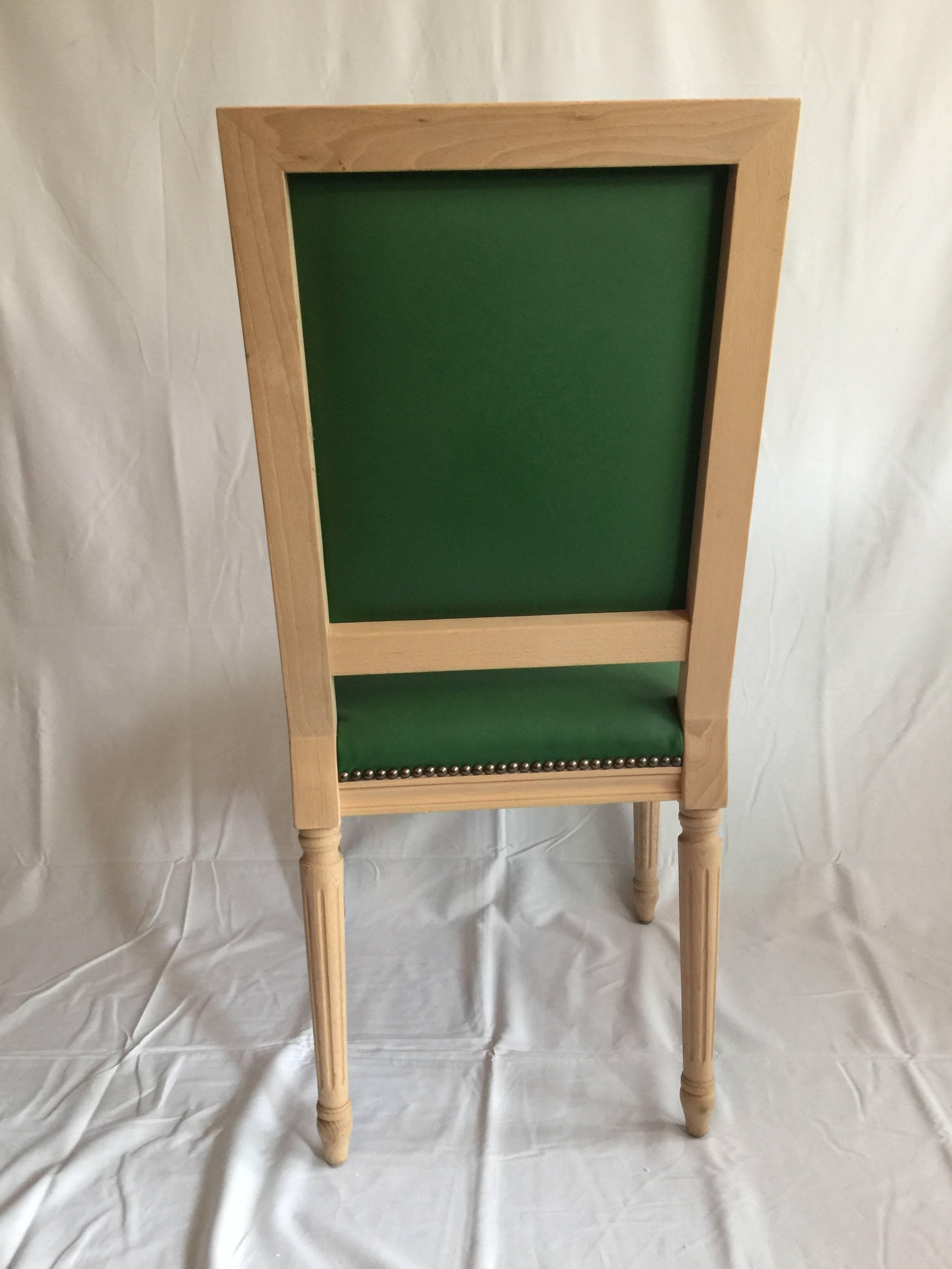 Square back Louis XVI style dining or side chair. Natural wood finish, custom colored Kelly green leather upholstery, antiqued brass nailhead detailing. Elegant carved details. 

Custom chairs with COM/COL and finish options available. Please