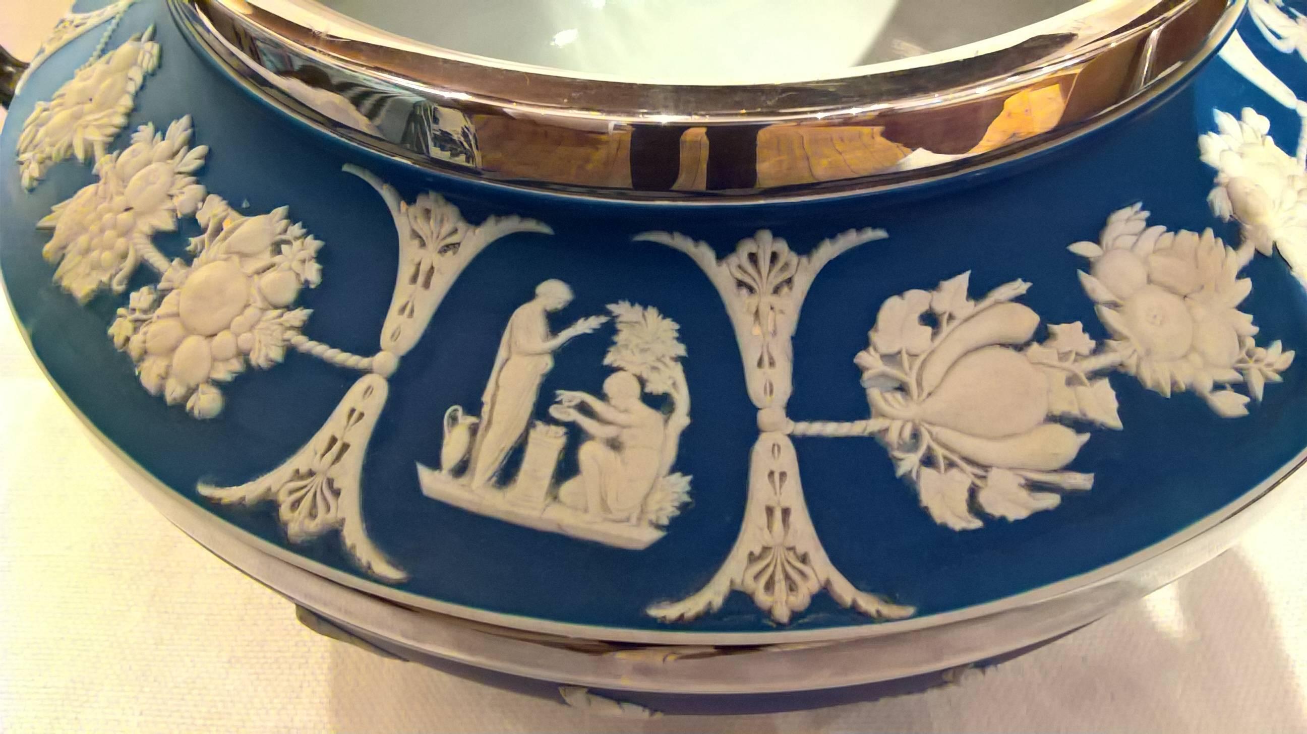 Large blue salad bowl or jardiniere from wedgwood in classic wedgwood decor and silver plated details and two handlings. Marked Wedgwood at the bottom. Looks also great with flowers.