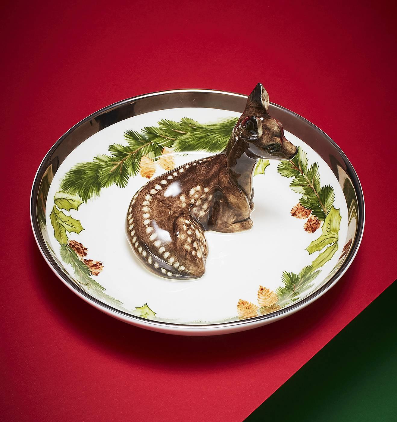Completely handmade porcelain bowl with a hands-free painted bambi in the center of the bowl. The charming bambi figure is painted in black and sits in the middle of the dish. The porcelain dish is platinum framed and decorated with a beautiful