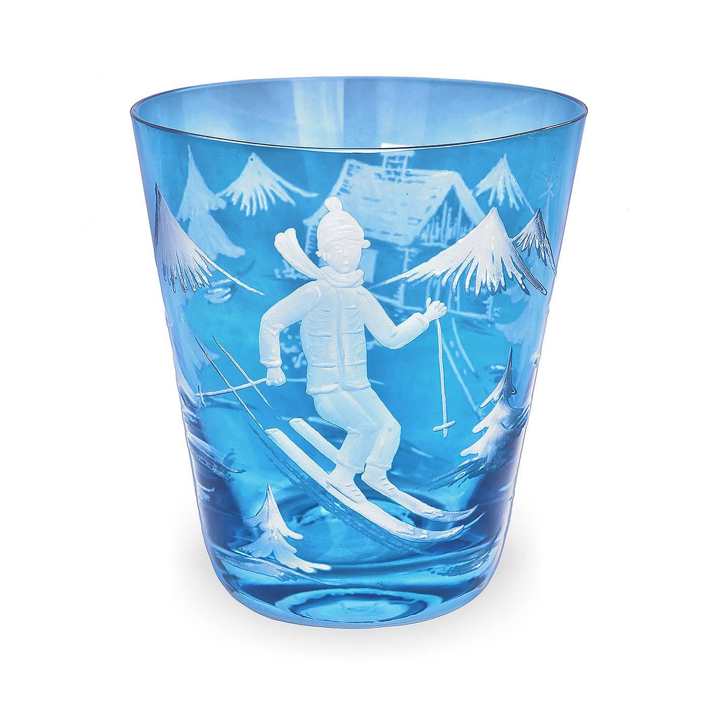 Hand-blown carafe in blue crystal with a charming skier decor. All around hand-engraved skier decor with trees, house and the skier. A matching tumbler and votiv is available in the same color
About sofina crystal:
 Sofina crystal was established in