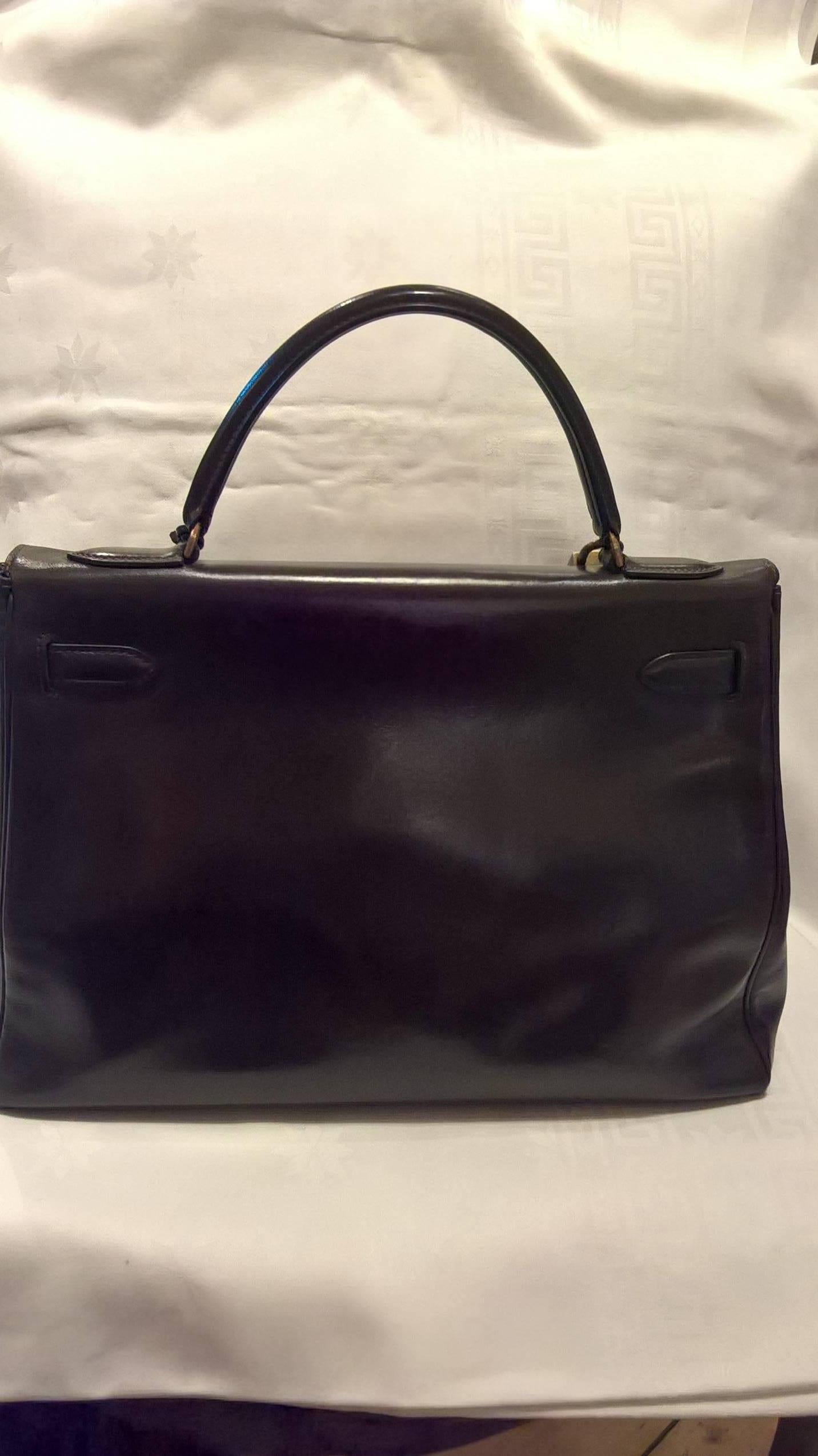 Vintage Hermes Kelly bag 28 cm in dark brown box calf leather. Gold hardware. Stamped B in a circle. Corners of the bag in very good condition. Barely used. No strap.