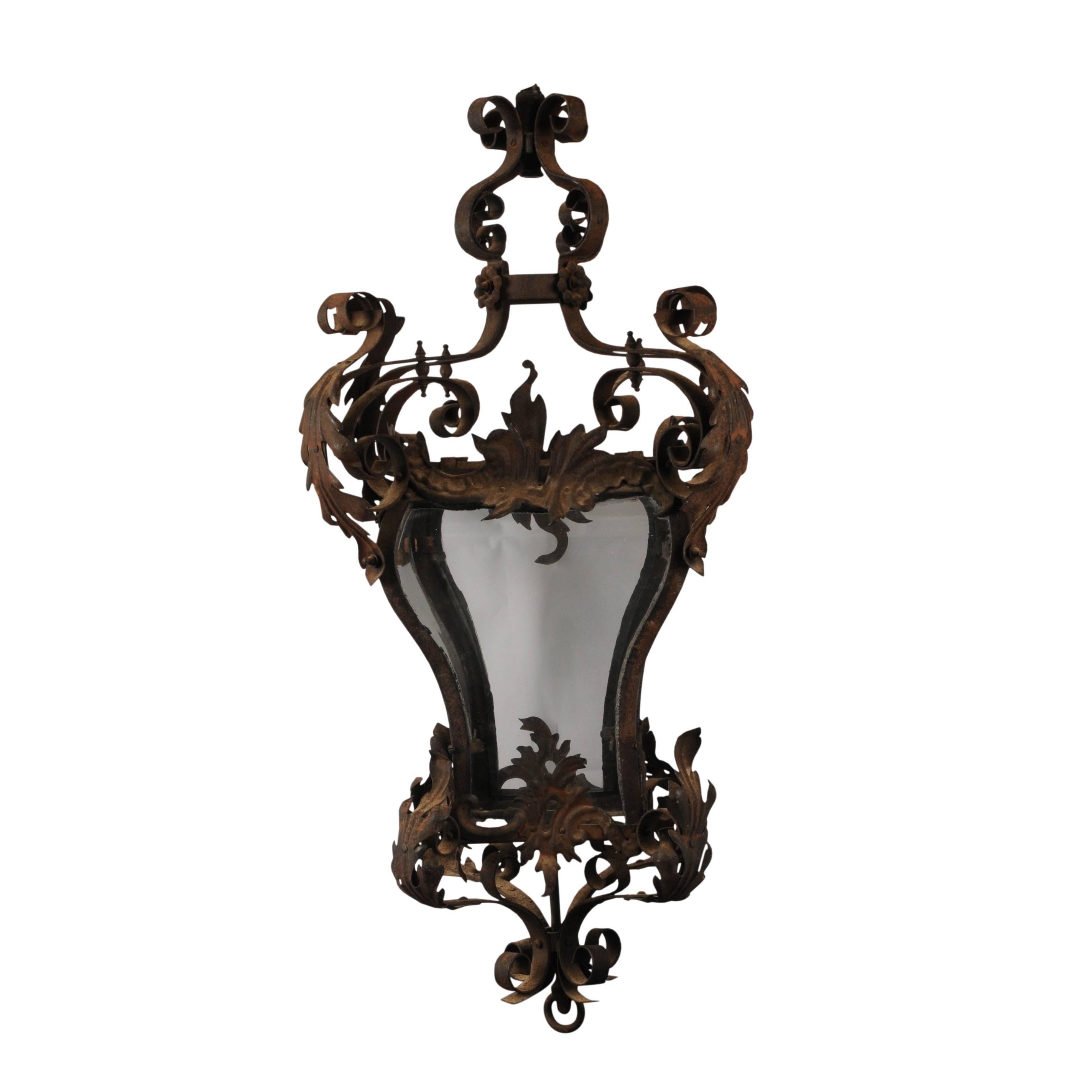 The frame being intricately formed from leafy scrollwork in the Baroque style. Originally made as a gas powered lantern with original gas tap pendant and wonderfully shaped original bombé glass panels. 

Currently not wired for electricity however