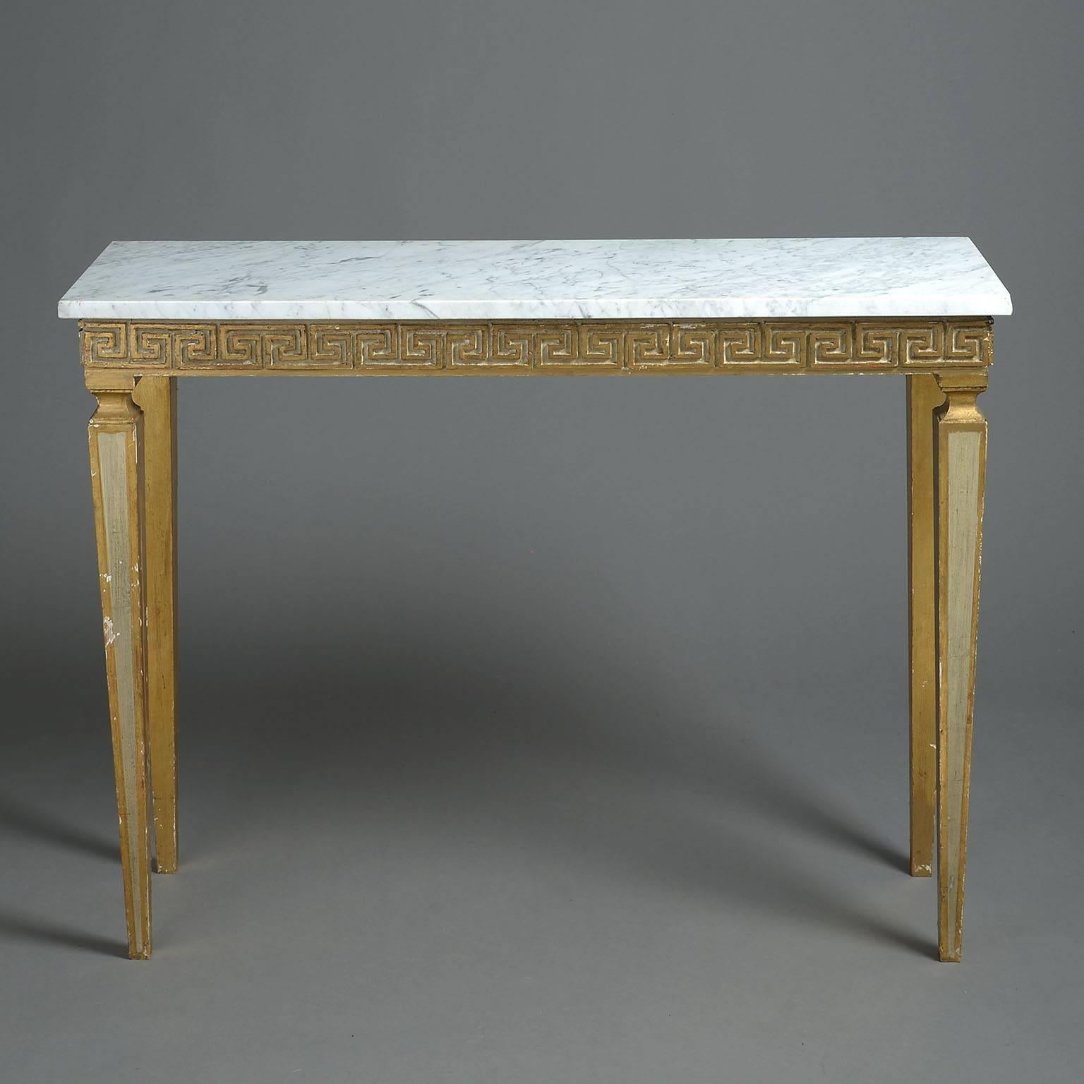 The Carrara marble-top over a painted and parcel-gilt blind-fret frieze of Greek-key decoration and raised on panelled, square tapering legs.