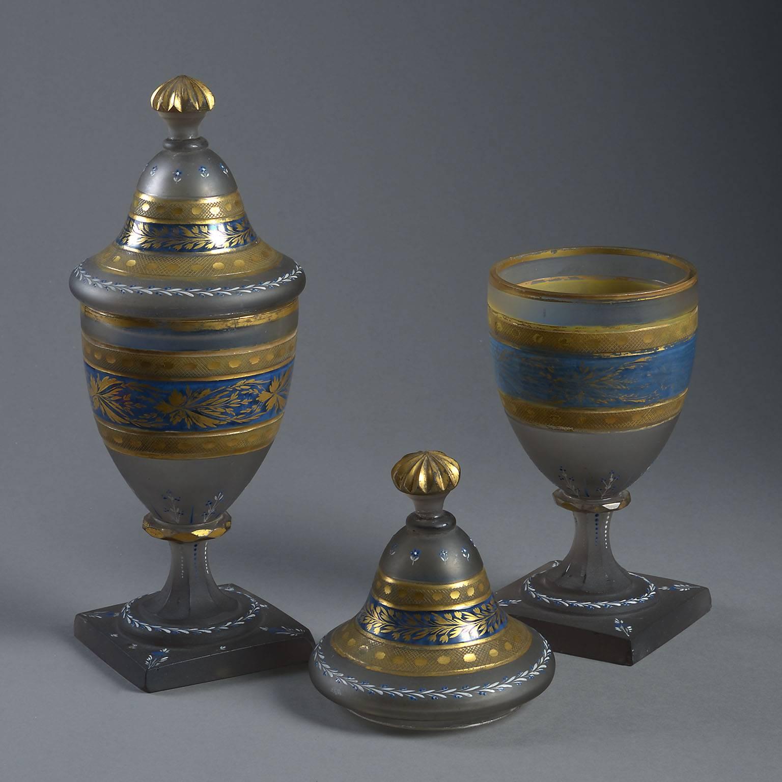 The urn shaped form decorated with bands of engraved and gilt foliage on a frosted and partly blue-painted ground.

France. Circa: 1810
 